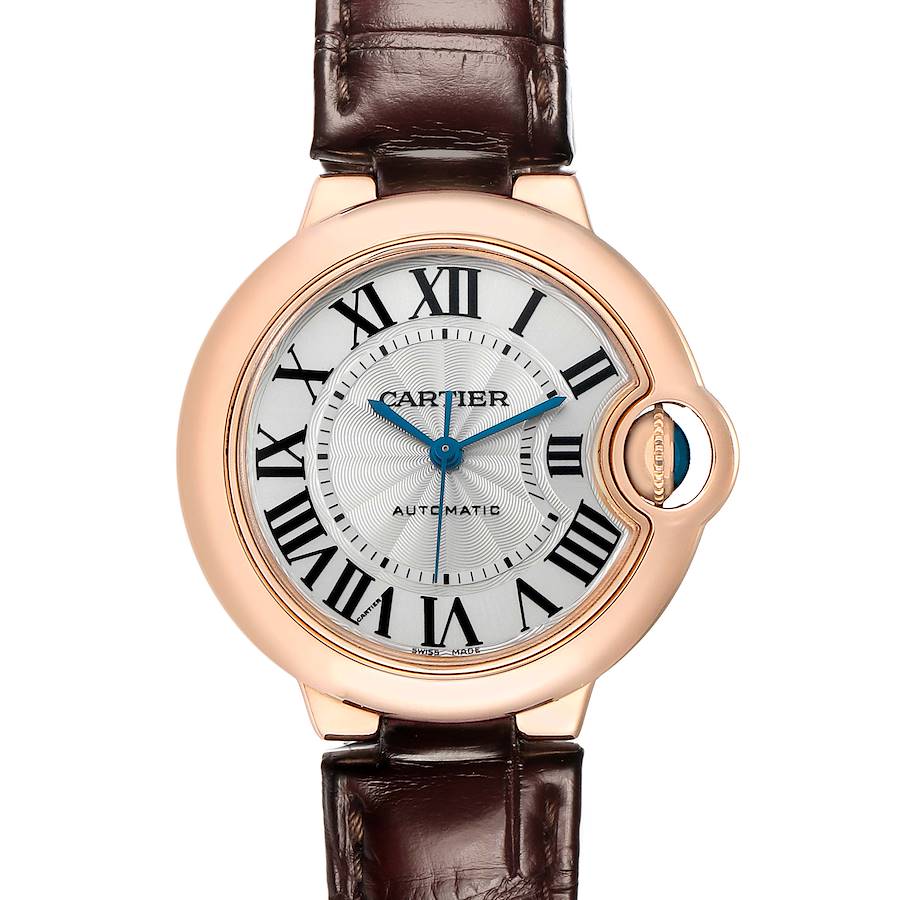The Cartier Ballon Bleu W6920097 Women's Rose Gold Silver Dial watch is shown from a front angle, highlighting its round dial, Roman numerals, and crown with a blue cabochon.