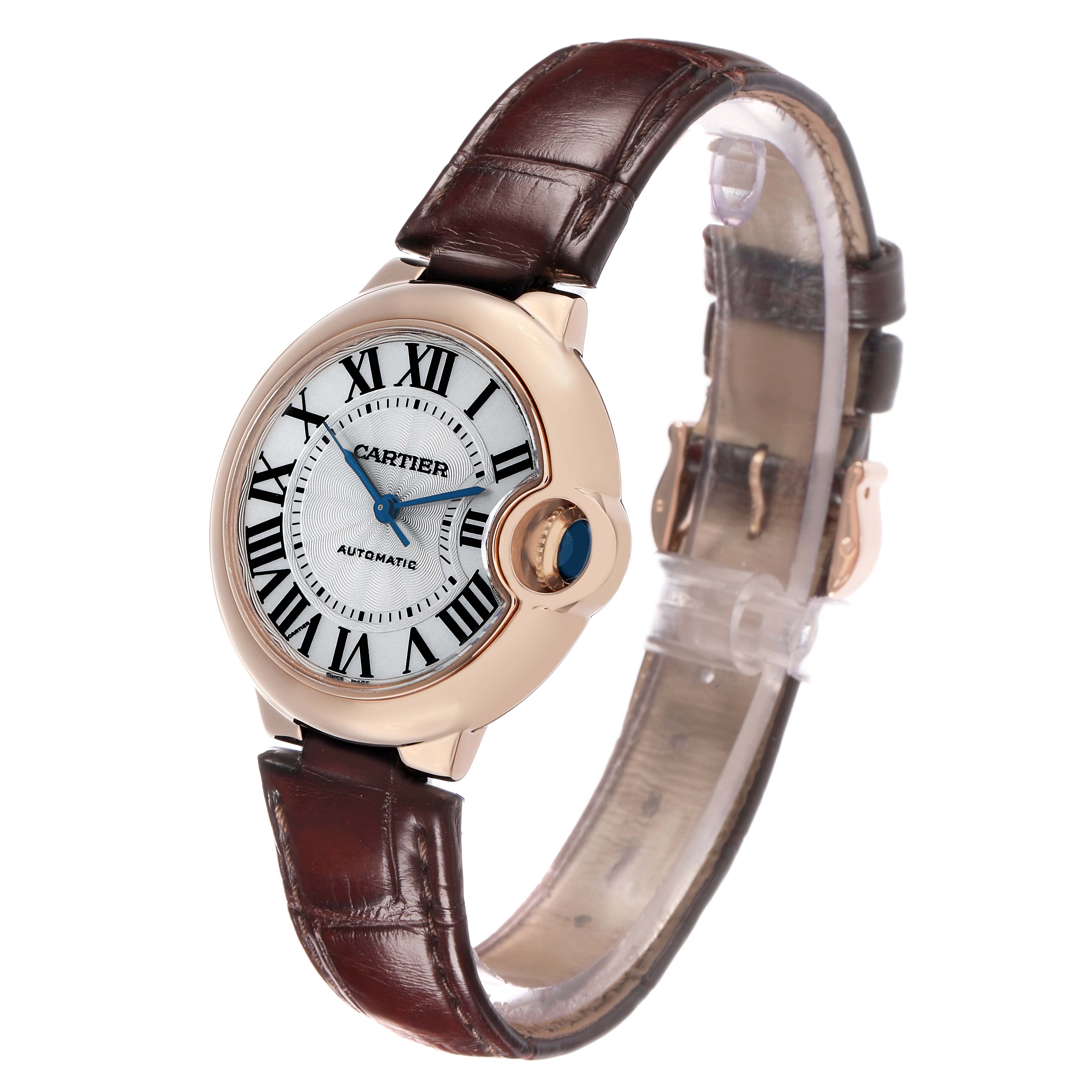 The Cartier Ballon Bleu W6920097 Women's Rose Gold Silver Dial watch is shown at a slight angle, displaying the dial, crown, and leather strap.