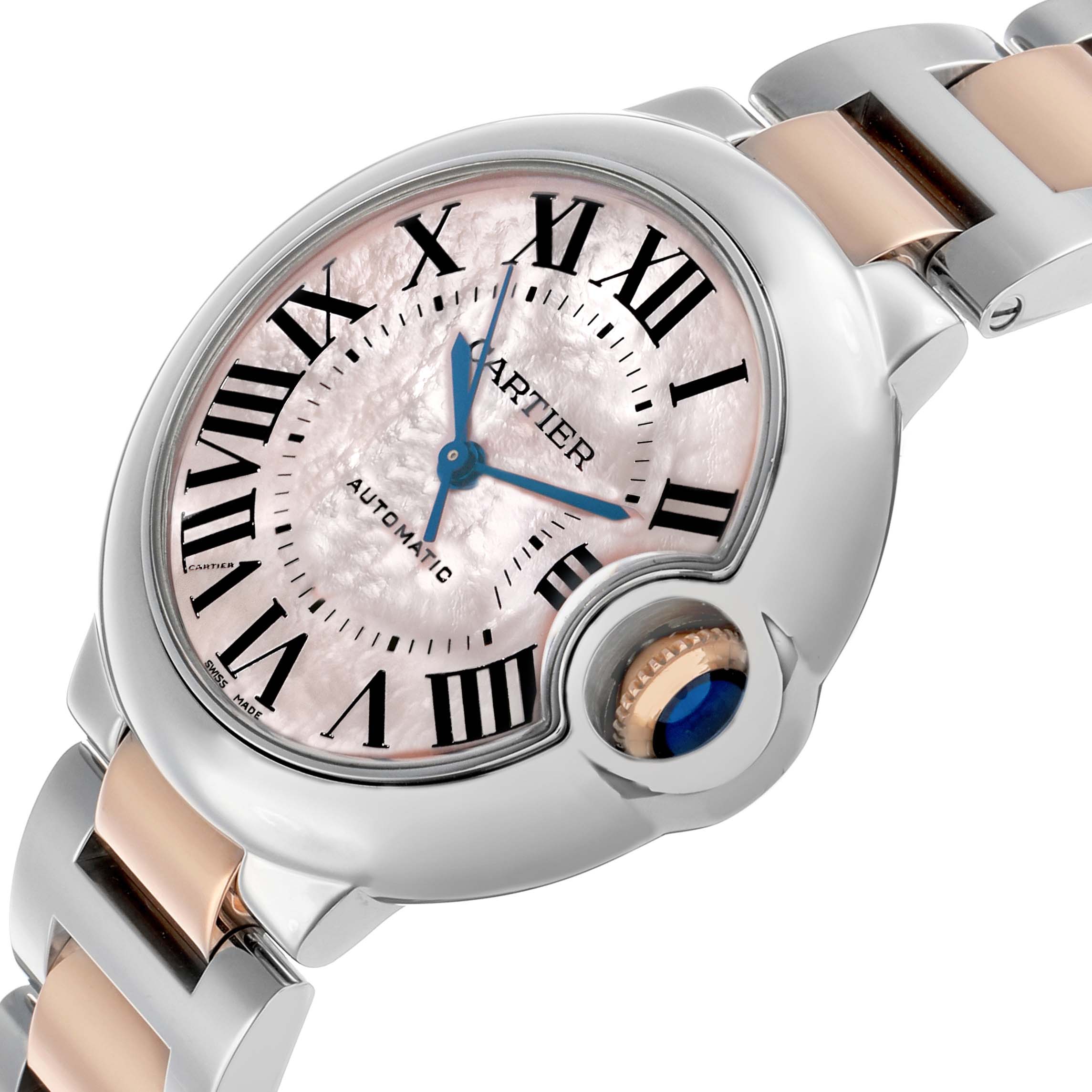 The Cartier Ballon Bleu W6920070 Women's Steel and Gold (two tone) Mother of Pearl Dial watch is shown at a close-up angle, highlighting its dial, Roman numerals, blue hands, and crown.