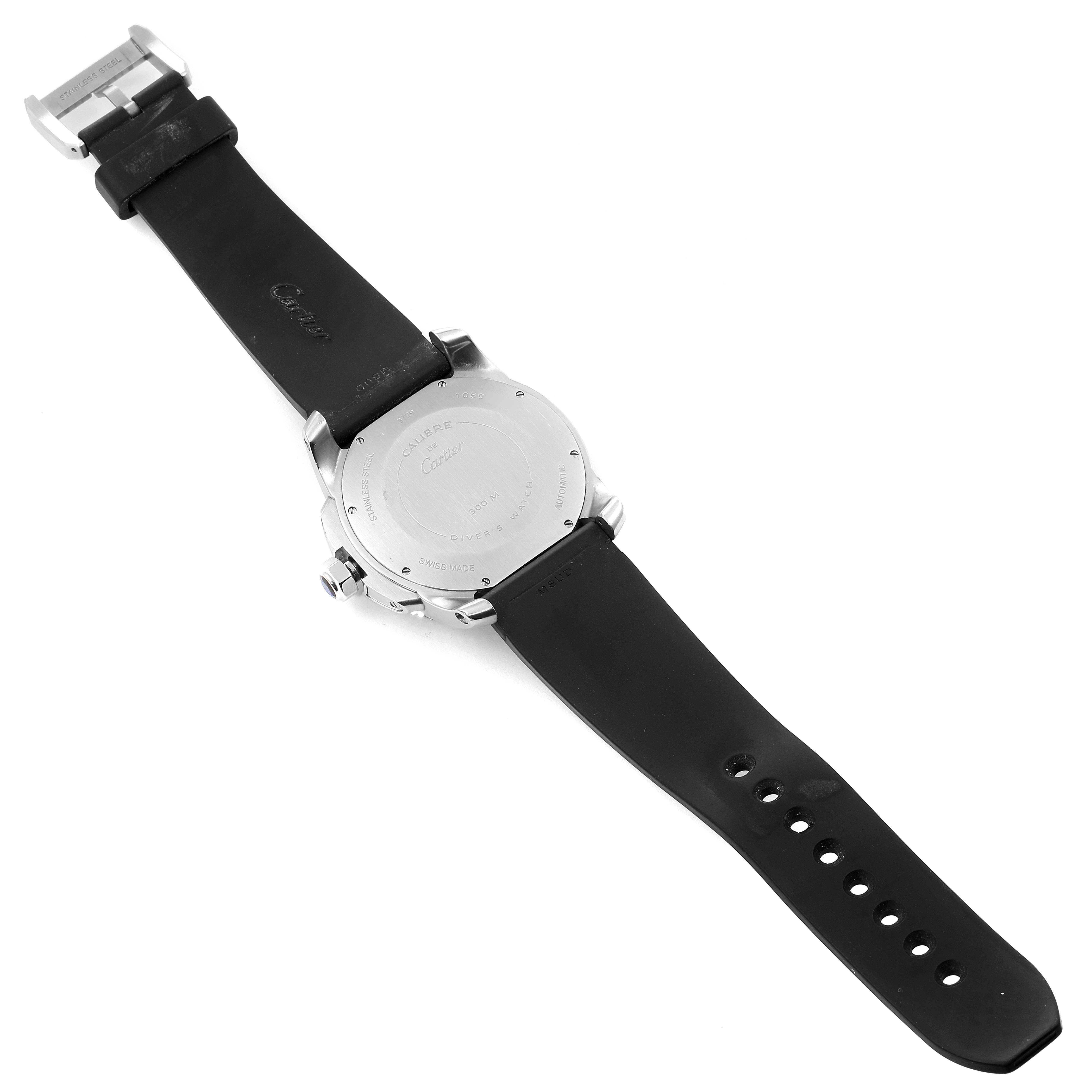 This image shows the back side of a Calibre de Cartier watch by Cartier, displaying the case back, strap, and buckle.