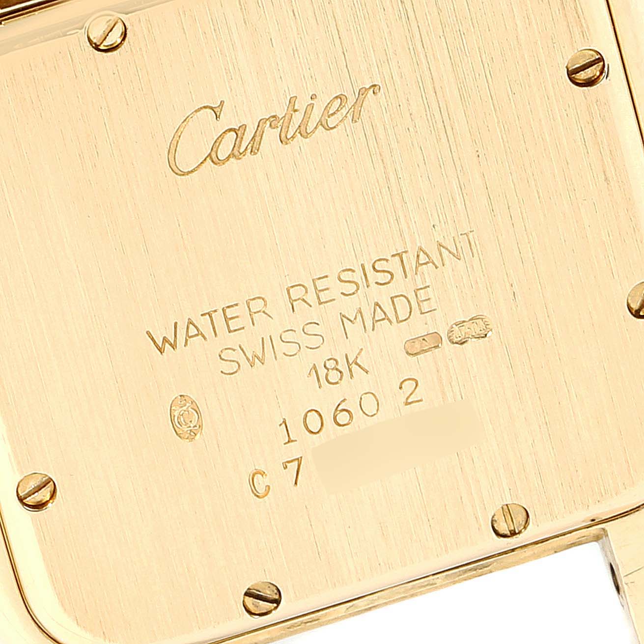 This is the back view of a Panthere model by Cartier, showcasing its 18K gold case and engraved details.