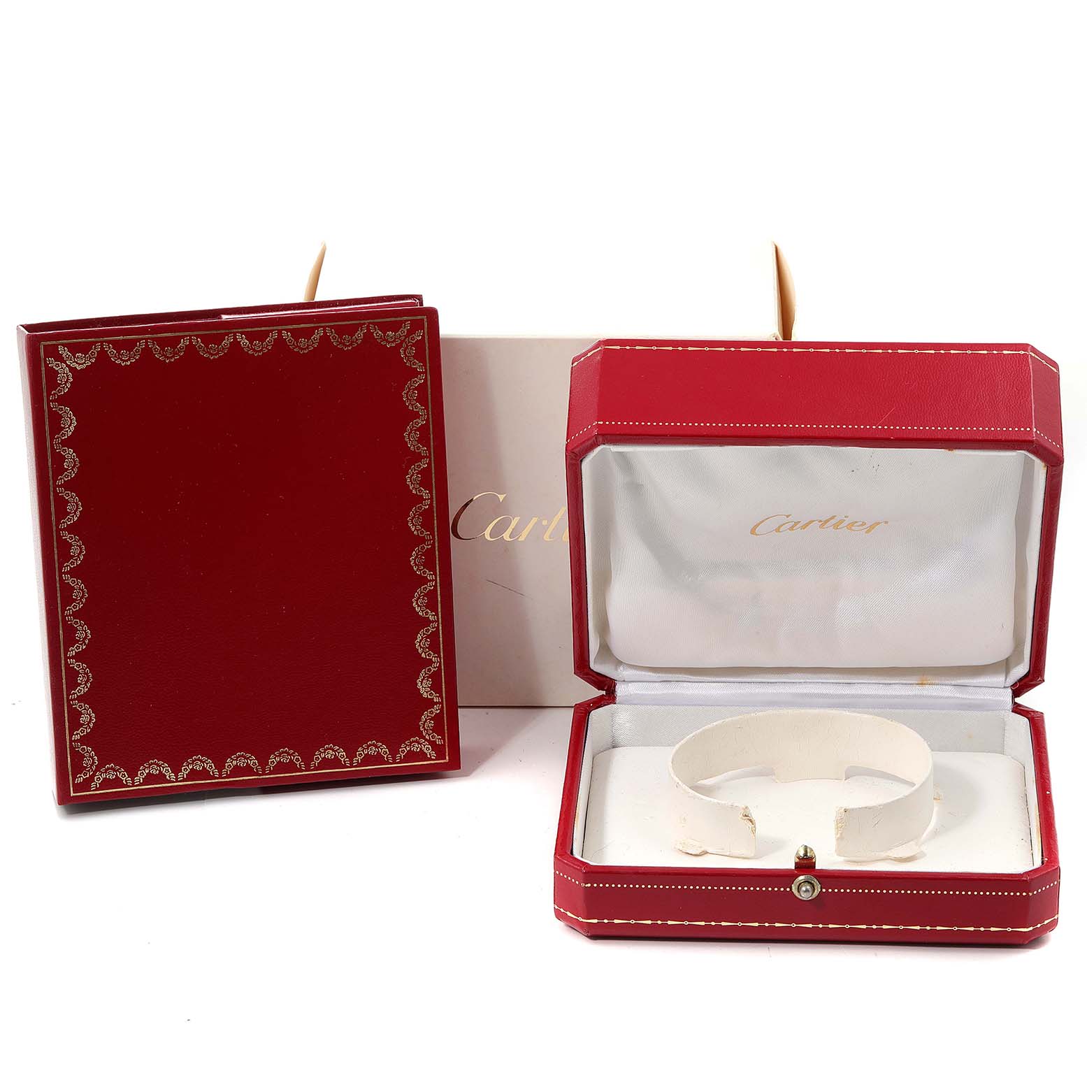 The image shows a Cartier Pasha W31074M7 Women's Stainless Steel White Dial W31074M7 Women's Stainless Steel White Dial watch box, including an open red case and a red booklet.