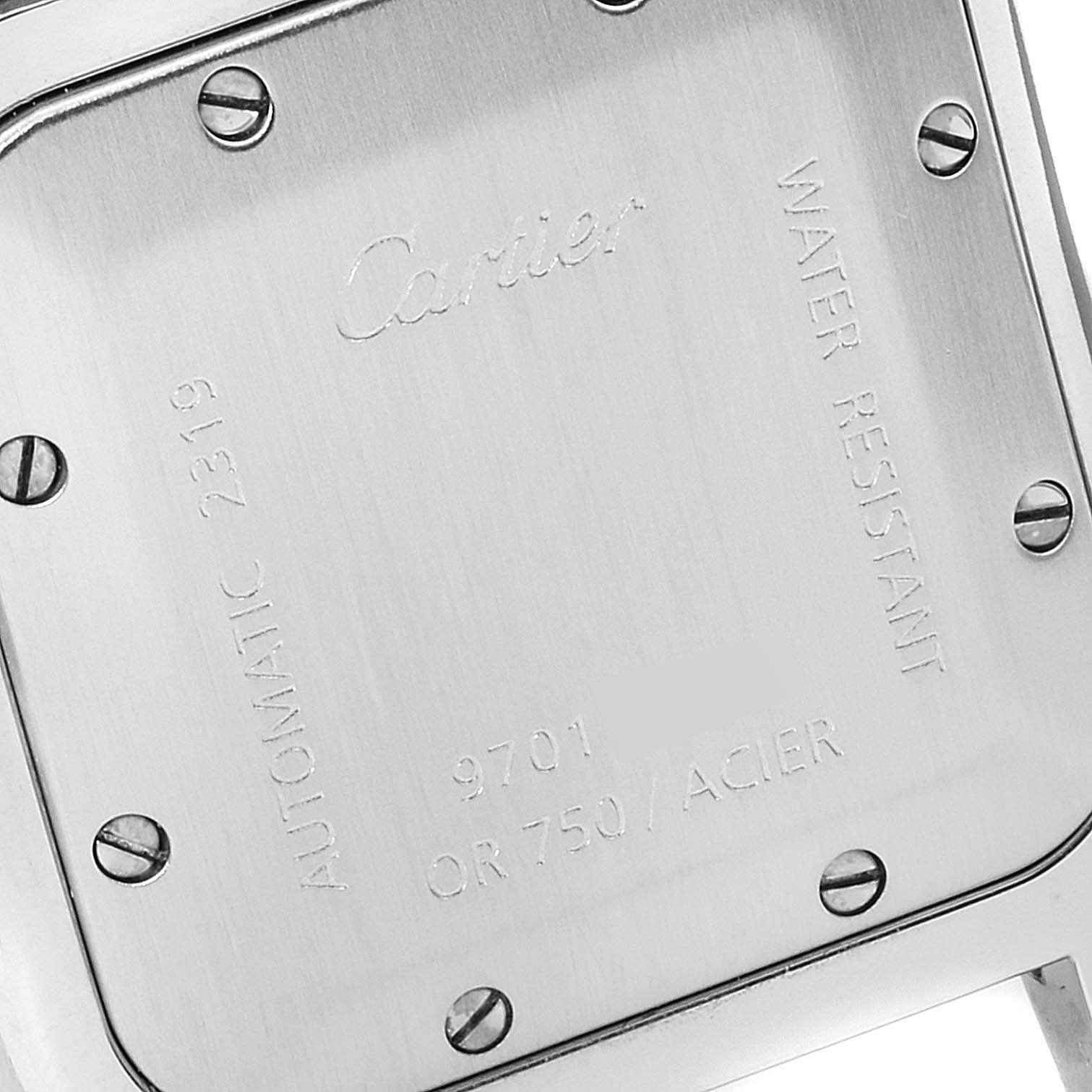This is a close-up image of the back case of the Santos model by Cartier, showing the engravings and screws.