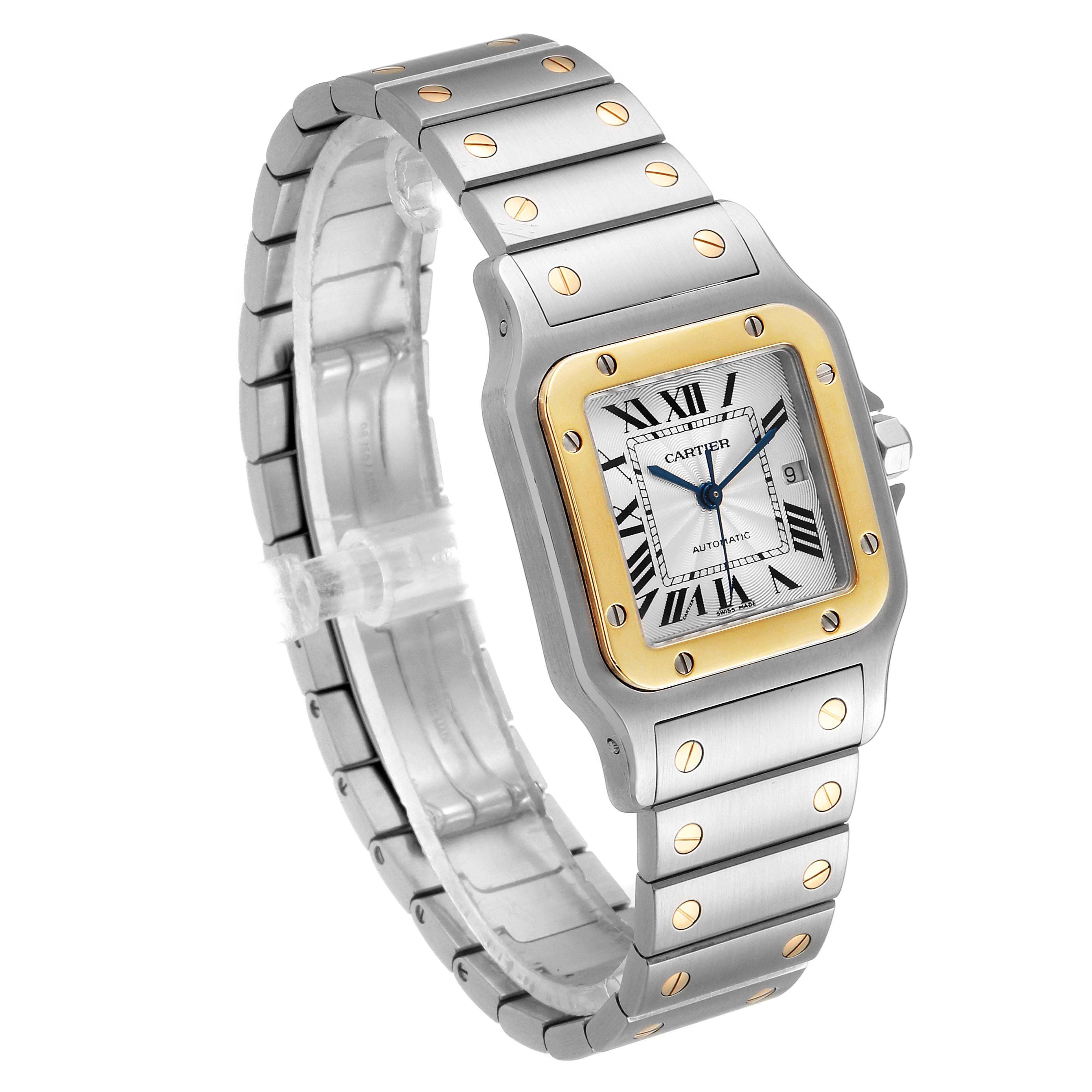 The image shows a Cartier Santos W20058C4 Men
s Steel and Gold (two tone) Silver Dial W20058C4 Men
s Steel and Gold (two tone) Silver Dial watch from an angled view, displaying the face, bezel, and bracelet.