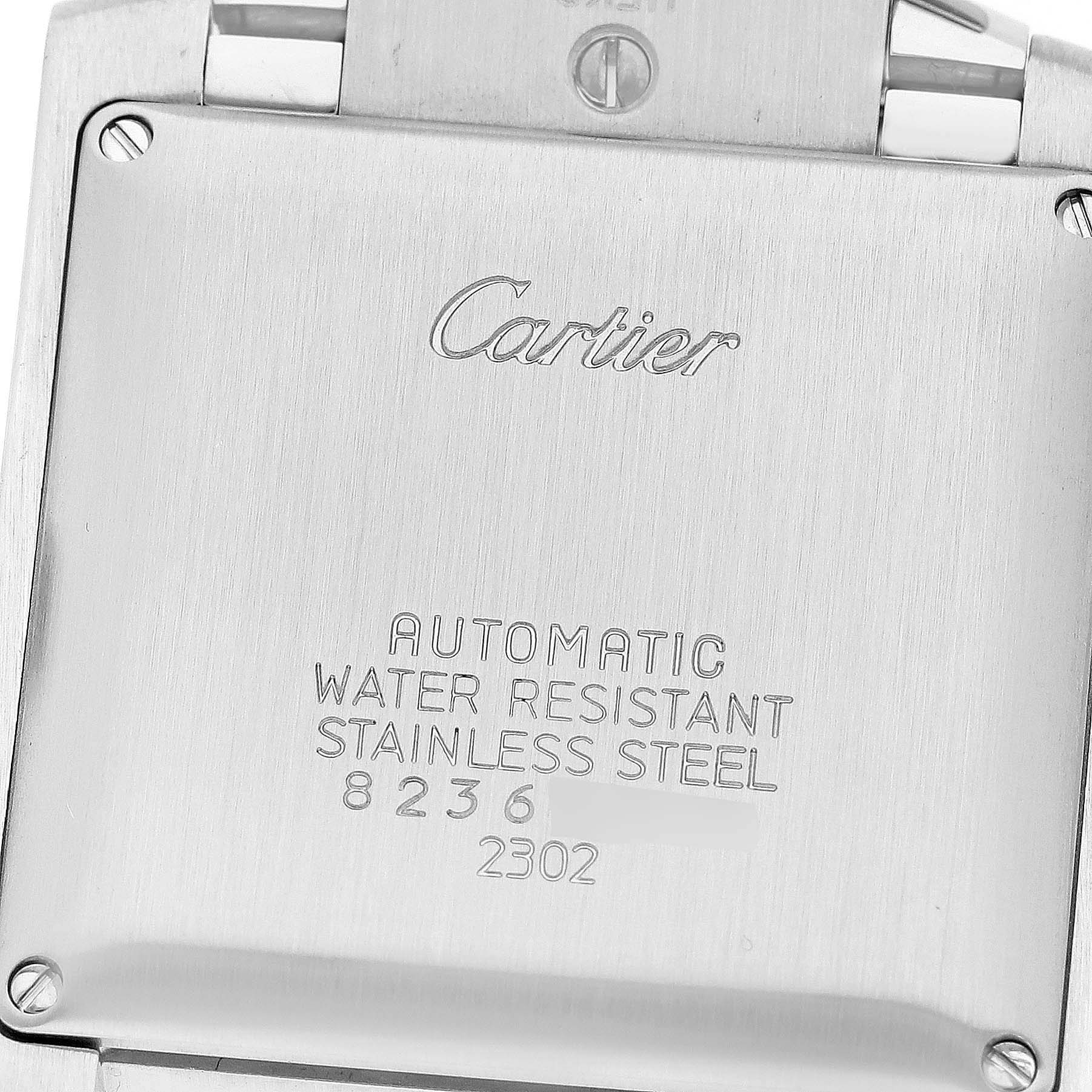This is a close-up of the back of a Cartier Tank Francaise W51002Q3 Men
s Stainless Steel Silver Dial W51002Q3 Men
s Stainless Steel Silver Dial watch, showing the engravings and screws.