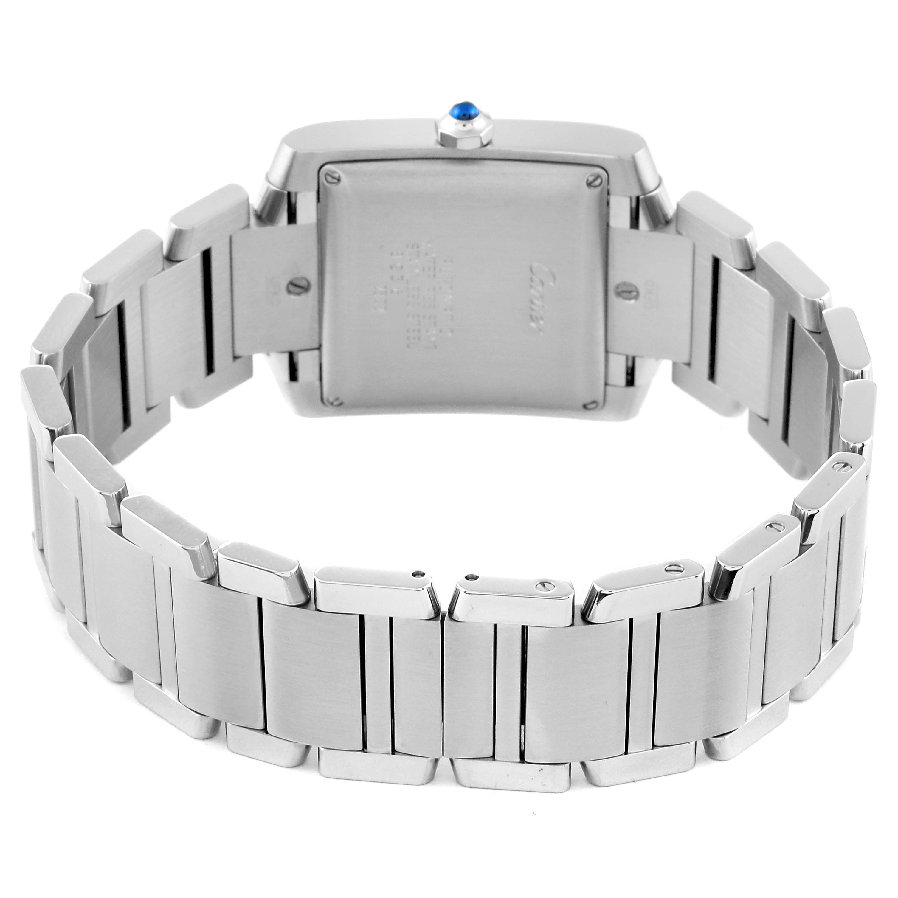 The image shows the back view of a Tank Francaise model by Cartier, highlighting the case back and metal bracelet.