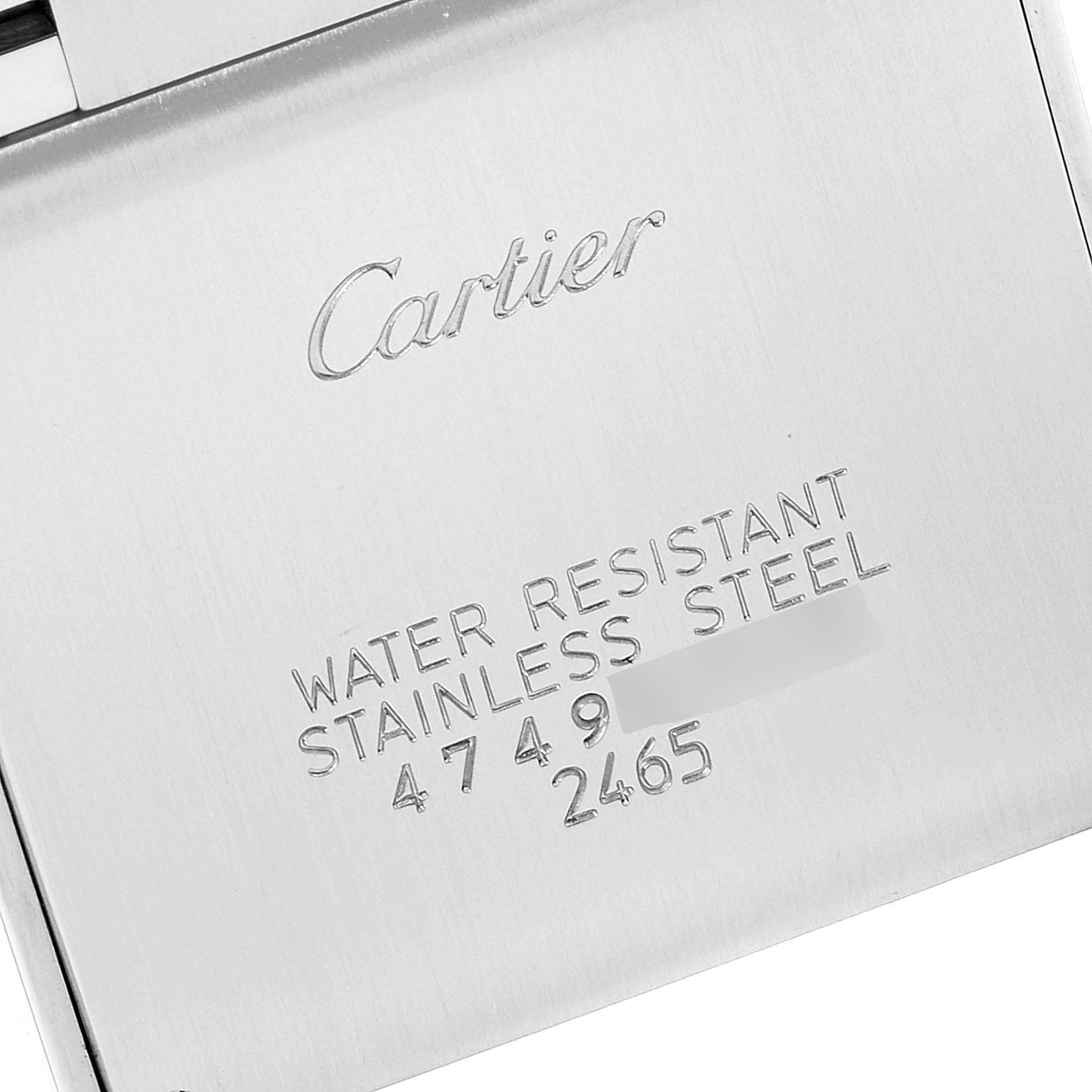 This image shows the back case of a Cartier Tank Française watch, highlighting its logo, water resistance, and stainless steel details.