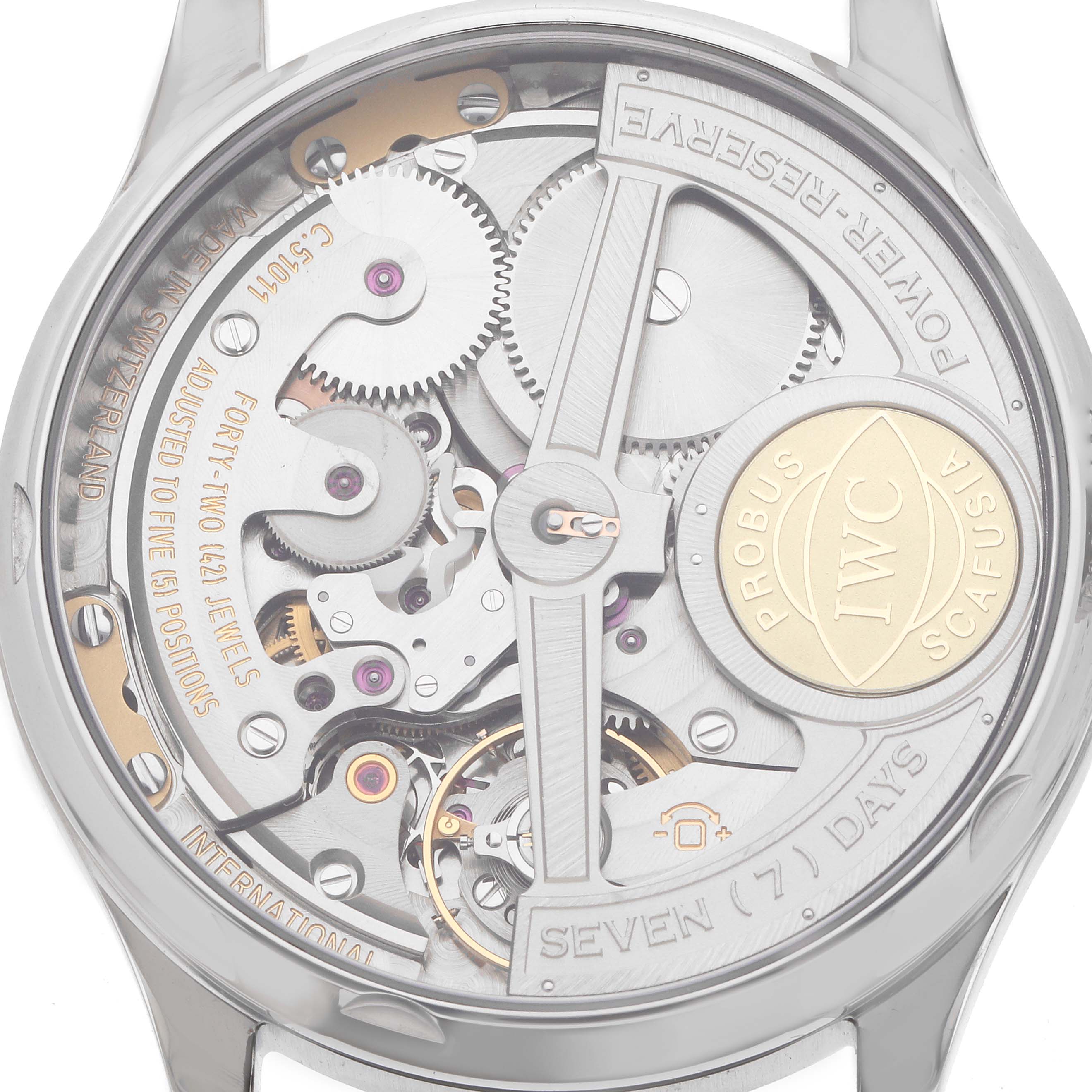 The image shows the back of an IWC Portuguese IW500114 Men's Stainless Steel Silver Dial watch, highlighting its intricate movement and gears.