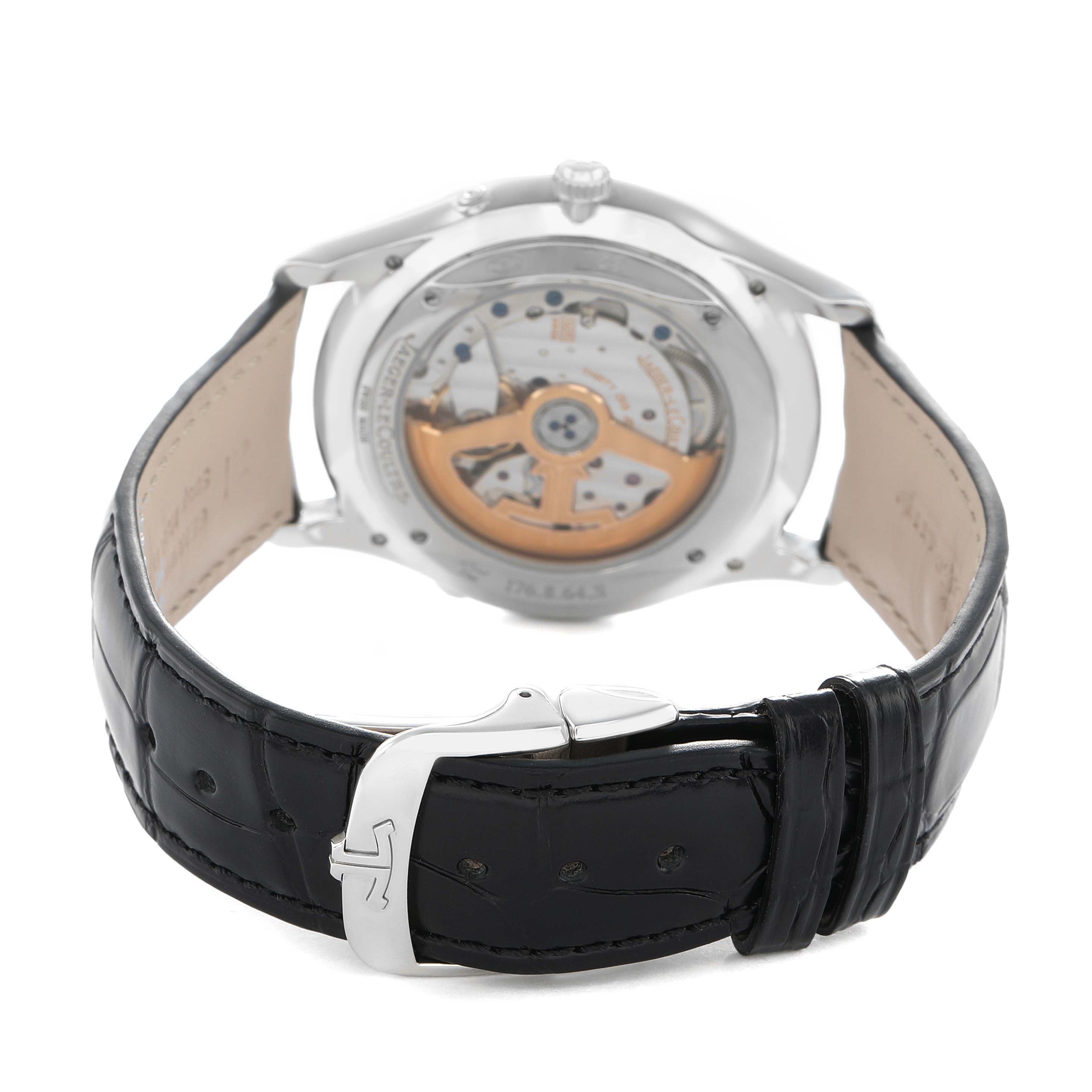 The Jaeger-LeCoultre Master model is shown from the back, highlighting the exhibition case back and black leather strap with clasp.