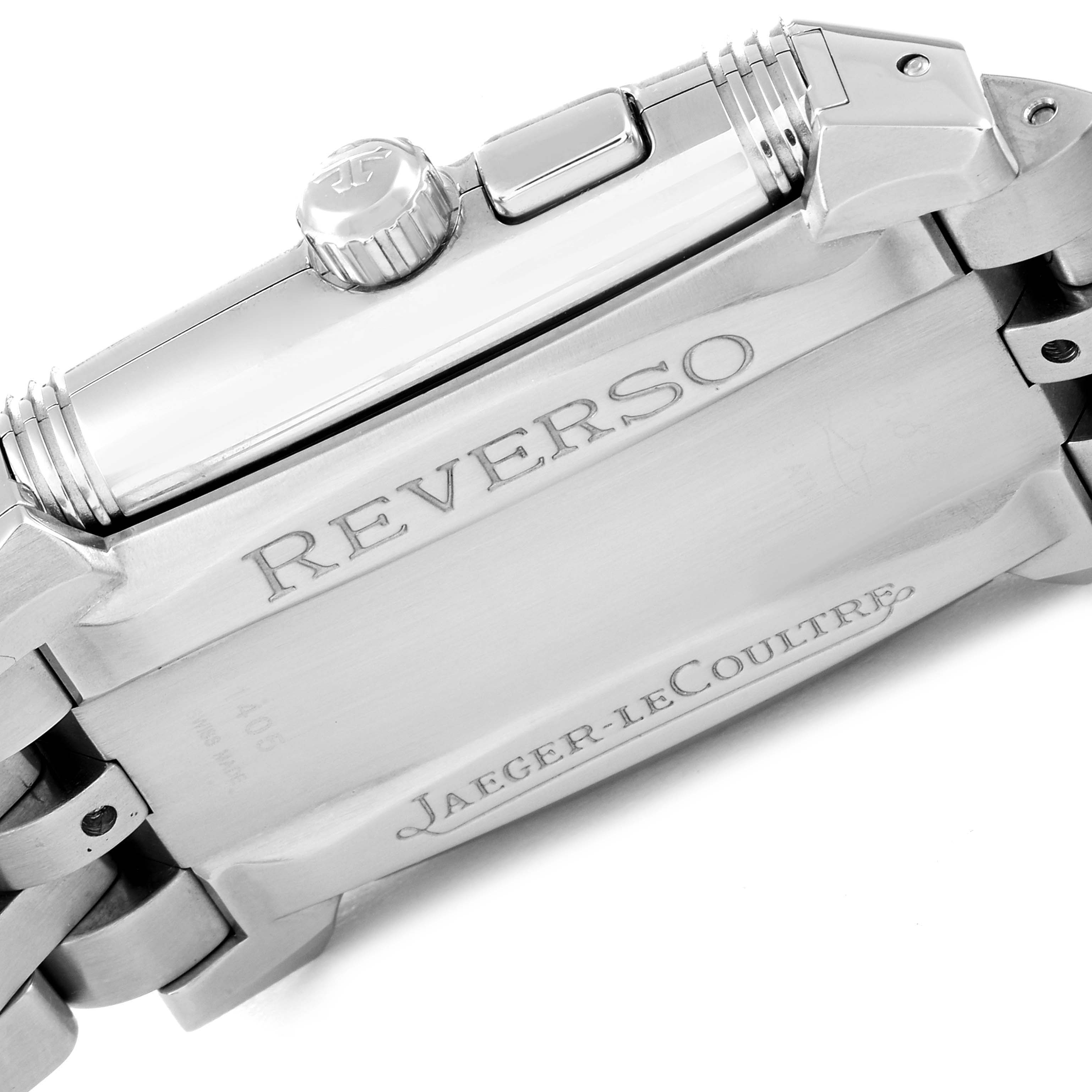 The image shows a close-up view of the Reverso model by Jaeger-LeCoultre, focusing on the crown, case back, and part of the bracelet.