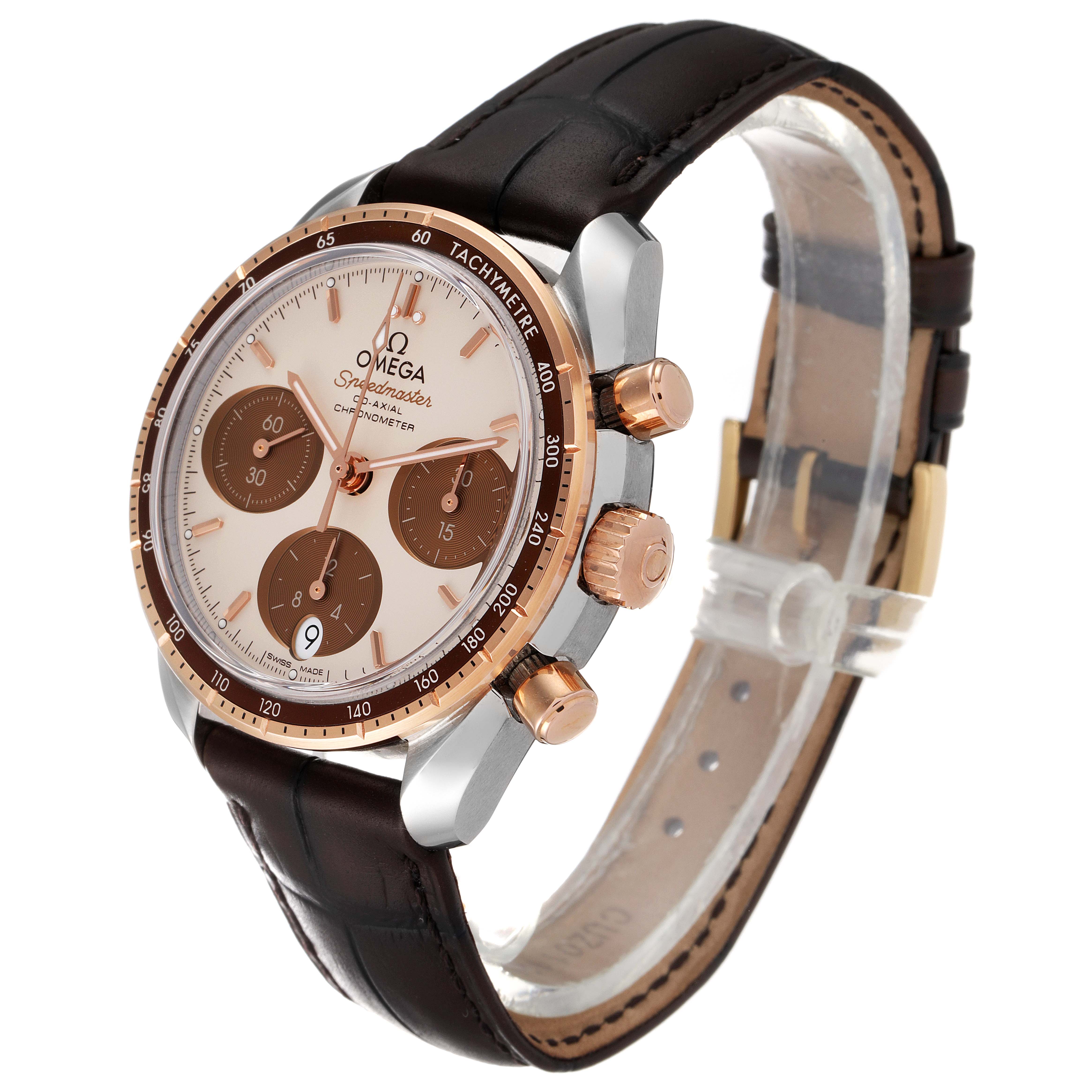 The image shows an Omega Speedmaster 324.23.38.50.02.002 Men's Steel and Gold (two tone) Silver Dial 324.23.38.50.02.002 Men's Steel and Gold (two tone) Silver Dial watch angled to display the face, side buttons, and leather strap.