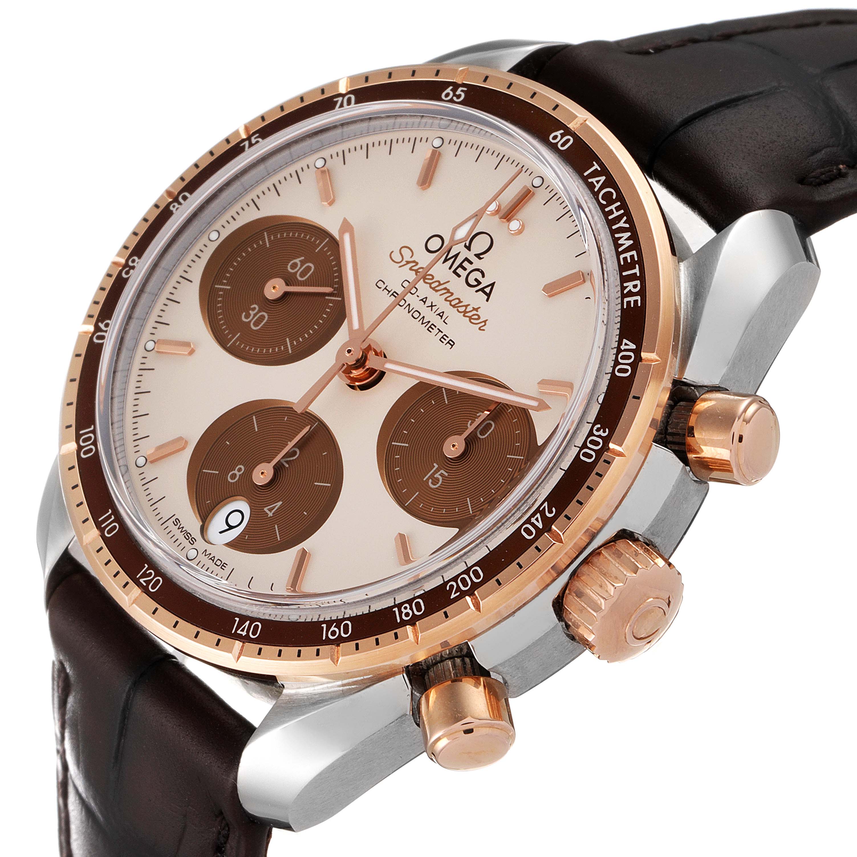 The Omega Speedmaster 324.23.38.50.02.002 Men's Steel and Gold (two tone) Silver Dial 324.23.38.50.02.002 Men's Steel and Gold (two tone) Silver Dial watch is at a three-quarter angle, showcasing its face, bezel, and pushers, with a brown leather strap.