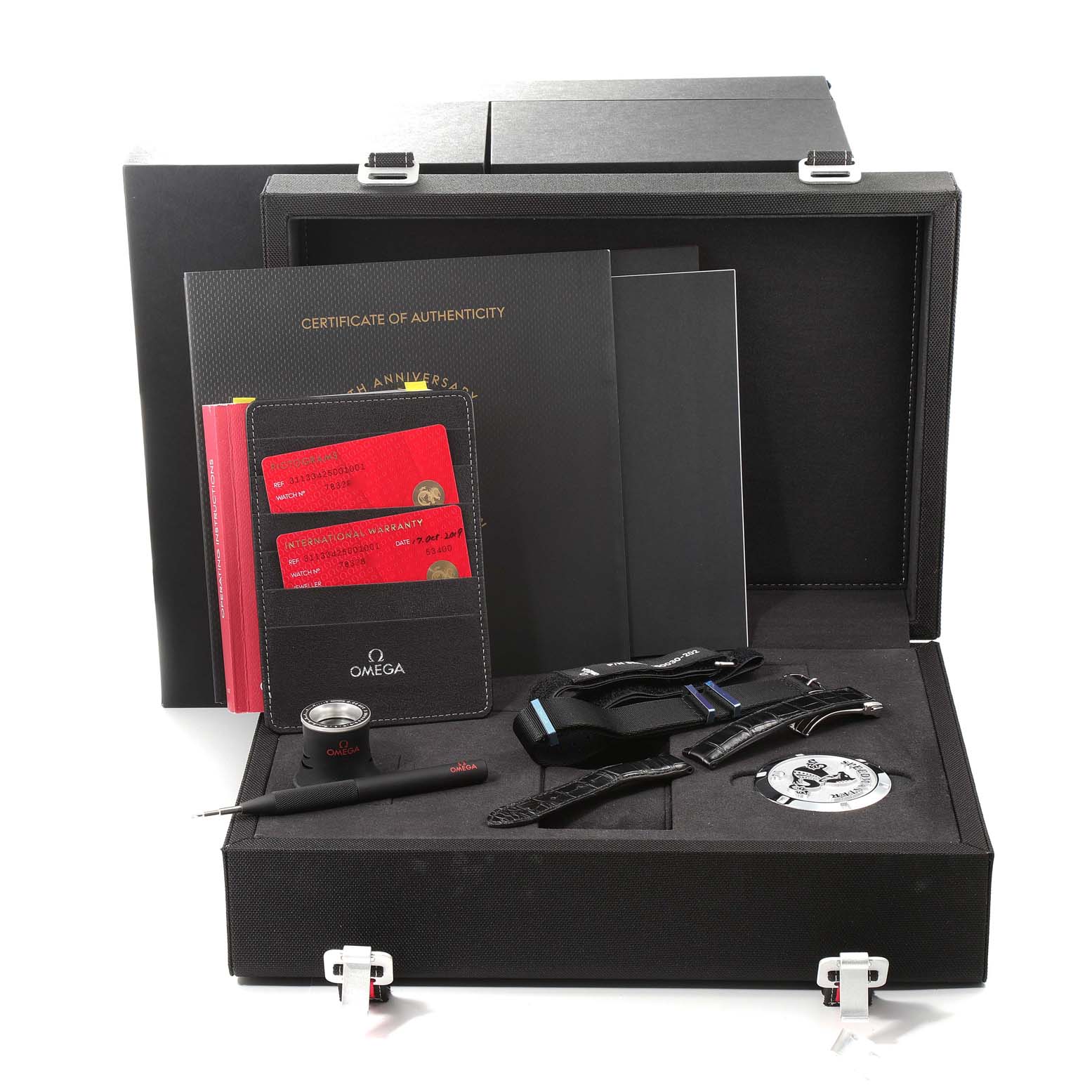 The image shows an Omega Speedmaster 311.33.42.50.01.001 Men's Stainless Steel Black Dial 311.33.42.50.01.001 Men's Stainless Steel Black Dial set including a Certificate of Authenticity, international warranty, straps, loupe, and toolkit in an open box.