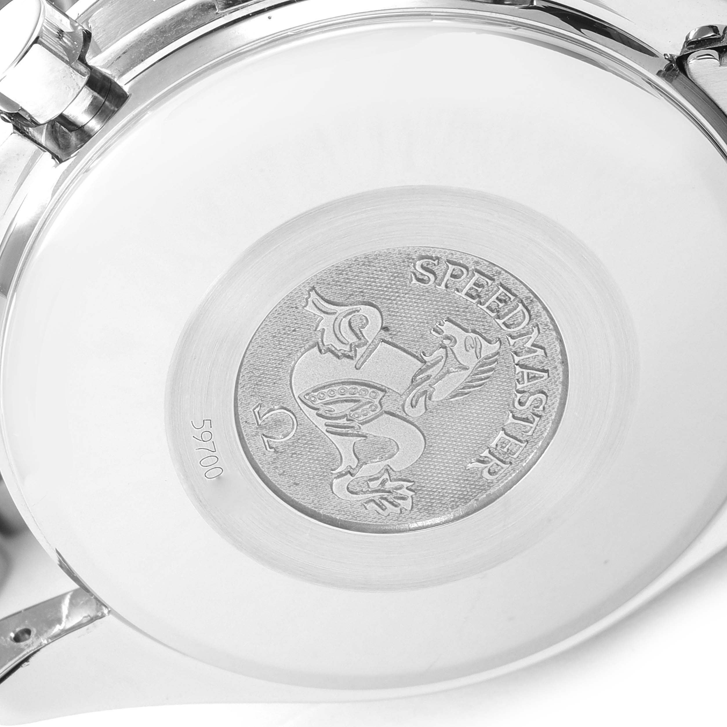 The image shows the back case of an Omega Speedmaster 3513.54.00 Men's Stainless Steel Black Dial 3513.54.00 Men's Stainless Steel Black Dial watch, highlighting the engraved emblem and model name.