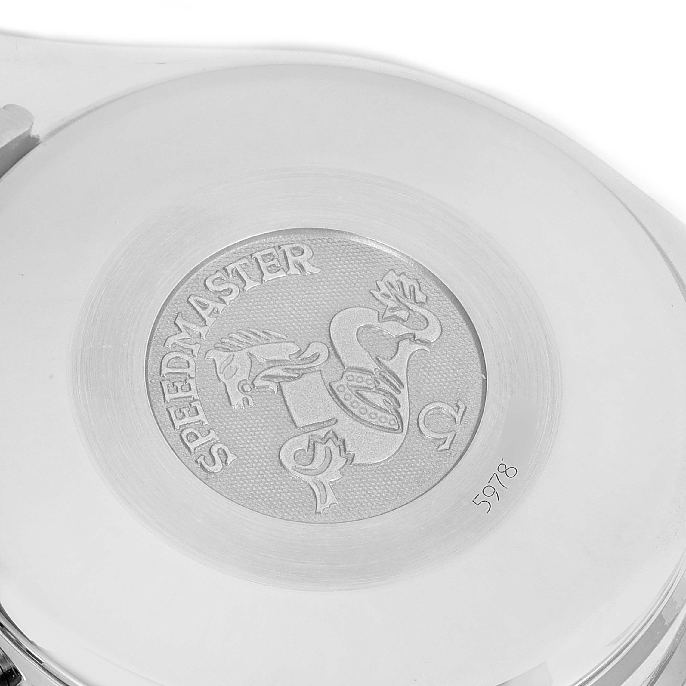 The image shows the back case of an Omega Speedmaster 3513.30.00 Men
s Stainless Steel Silver Dial 3513.30.00 Men
s Stainless Steel Silver Dial watch, engraved with the Speedmaster logo and a unique serial number.