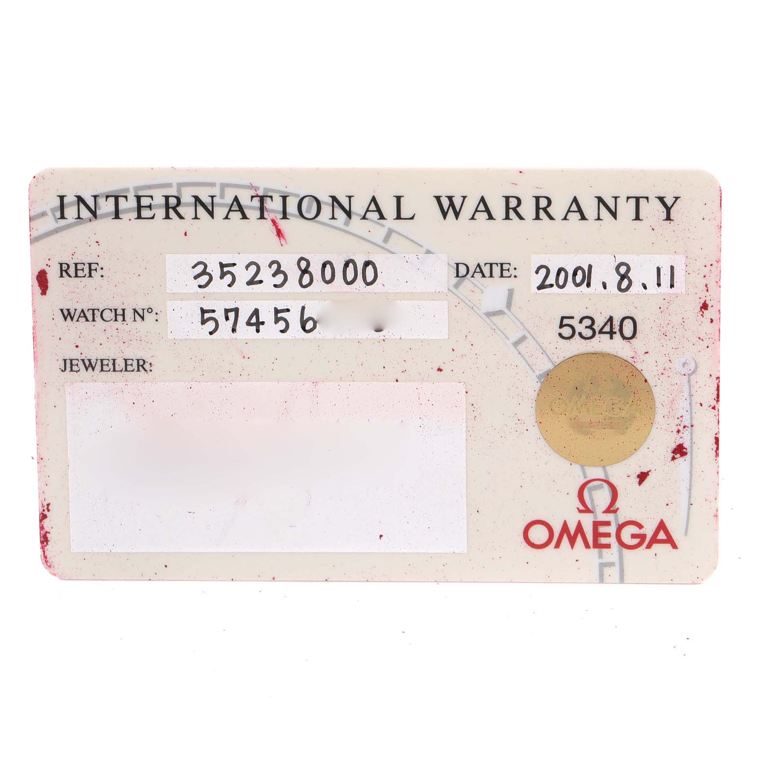 The image shows an Omega Speedmaster 3523.80.00 Men
s Stainless Steel Blue Dial 3523.80.00 Men
s Stainless Steel Blue Dial International Warranty card featuring reference number, watch number, date, jeweler, and Omega logo.