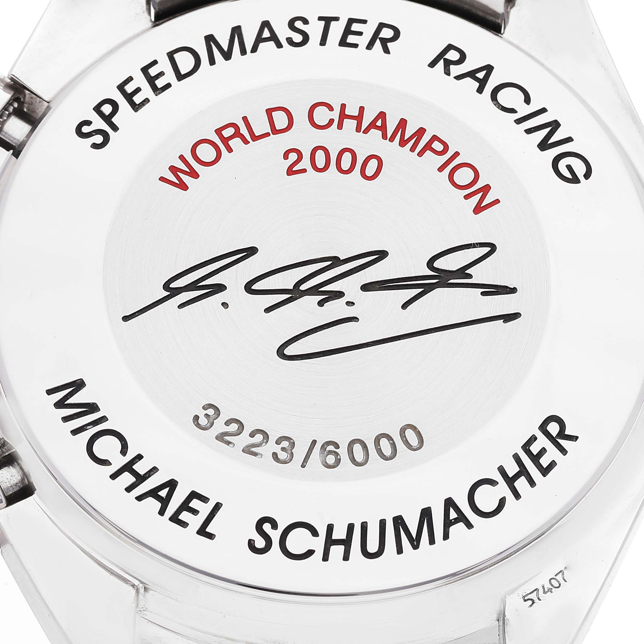 The image shows the back casing of an Omega Speedmaster 3518.50.00 Men's Stainless Steel Black Dial 3518.50.00 Men's Stainless Steel Black Dial Racing watch, featuring engravings and a signature.