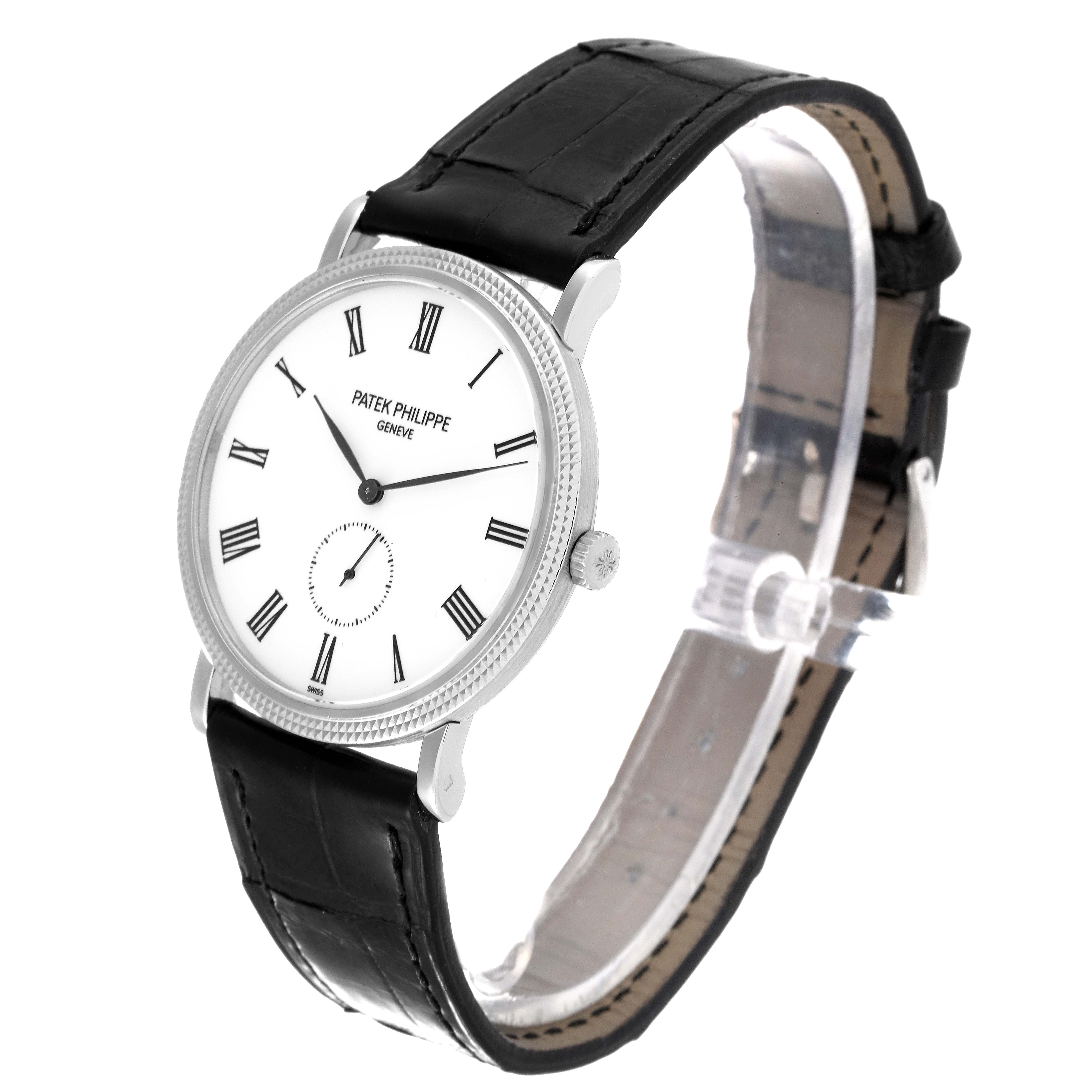 The image shows a Patek Philippe Calatrava 5119G Men's White Gold White Dial 5119G Men's White Gold White Dial watch from a three-quarter angle, highlighting the dial, bezel, and leather strap.