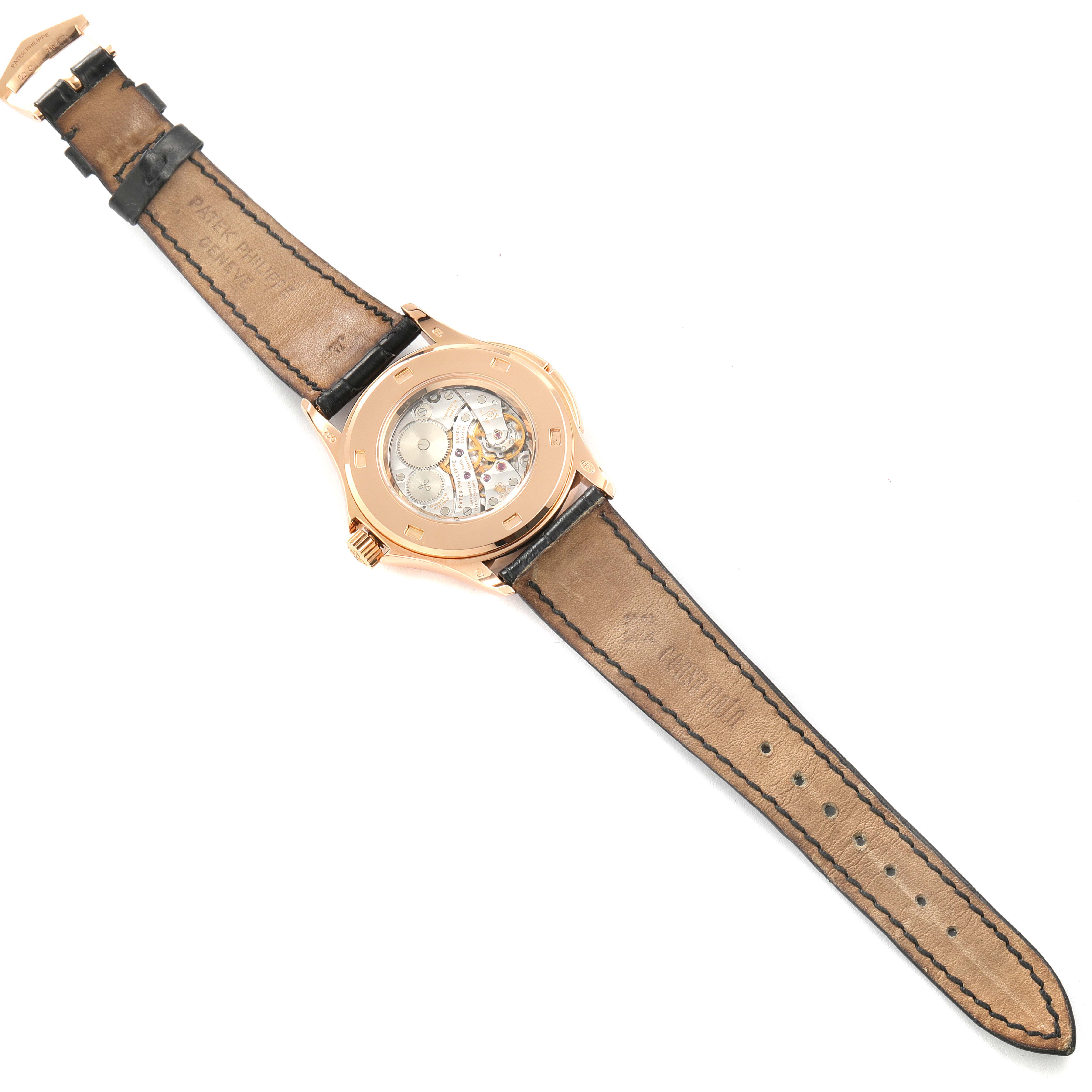 This image shows the back view of the Patek Philippe Calatrava 5134R-011 Men
s Rose Gold Silver Dial 5134R-011 Men
s Rose Gold Silver Dial watch, highlighting the leather strap and the watch
s internal mechanisms.