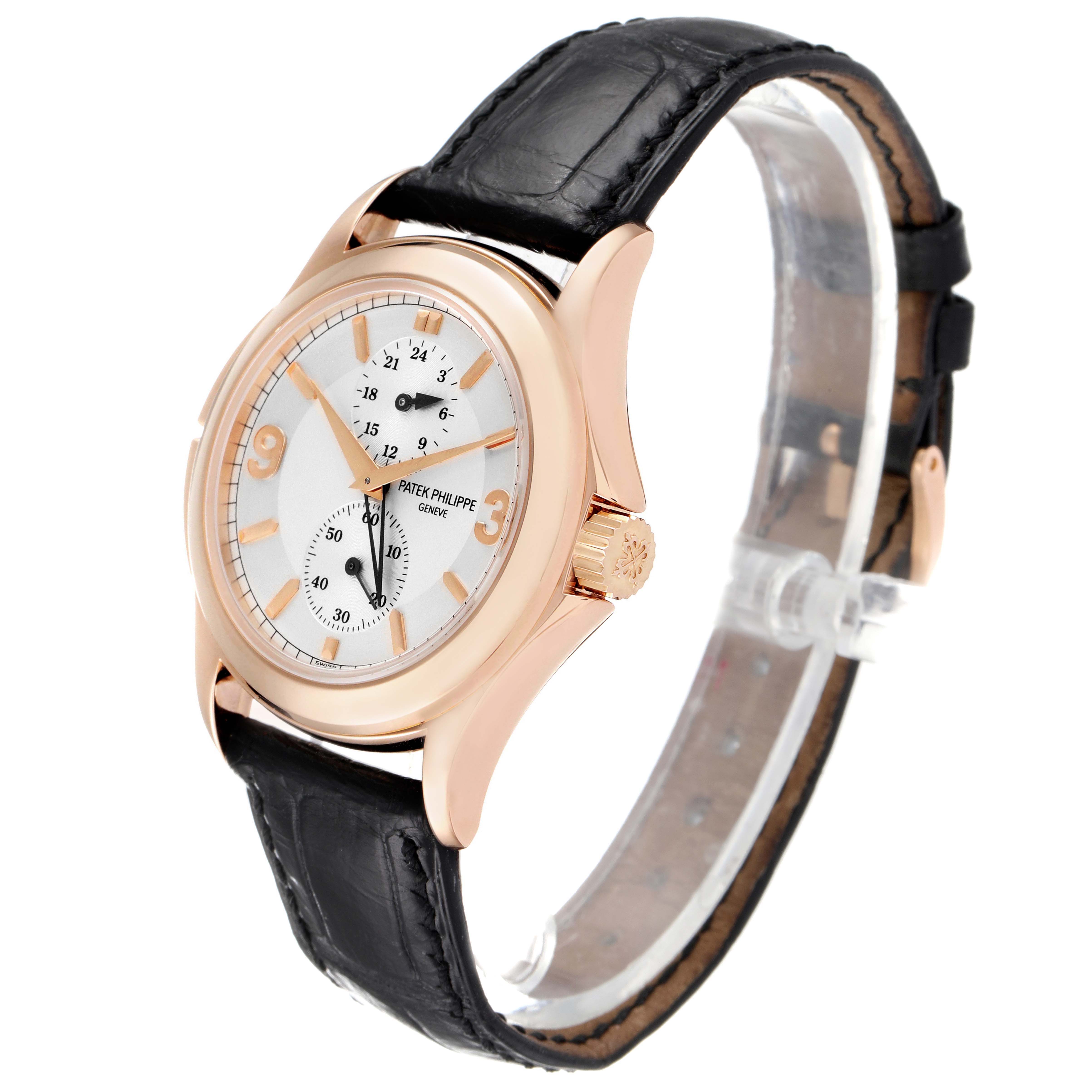 The image shows a side angle of the Patek Philippe Calatrava 5134R-011 Men
s Rose Gold Silver Dial 5134R-011 Men
s Rose Gold Silver Dial watch, highlighting the dial, crown, and leather strap.