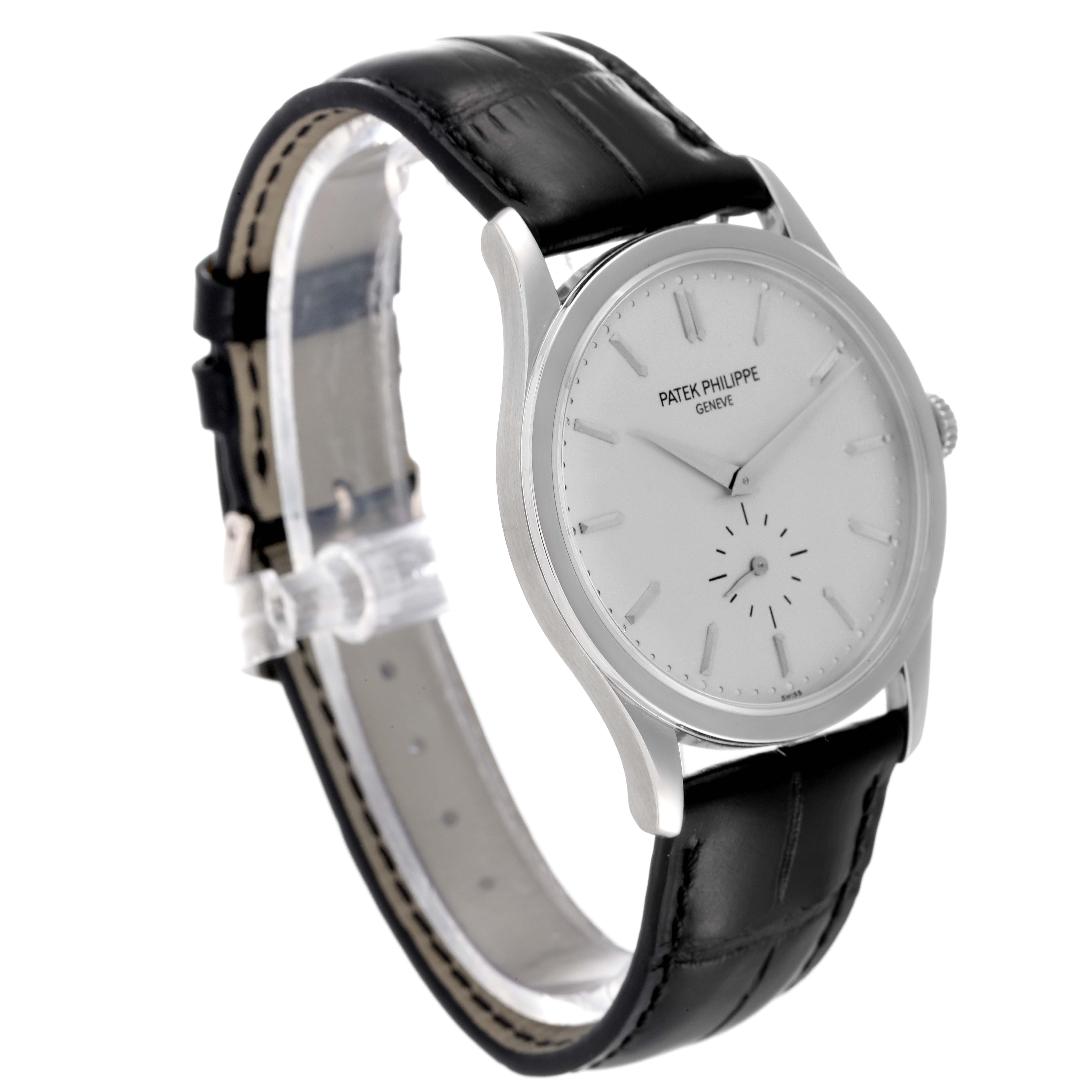 This image shows a Patek Philippe Calatrava 5196G Men's White Gold Silver Dial 5196G Men's White Gold Silver Dial watch at a three-quarter angle, featuring a black leather strap and a white dial.