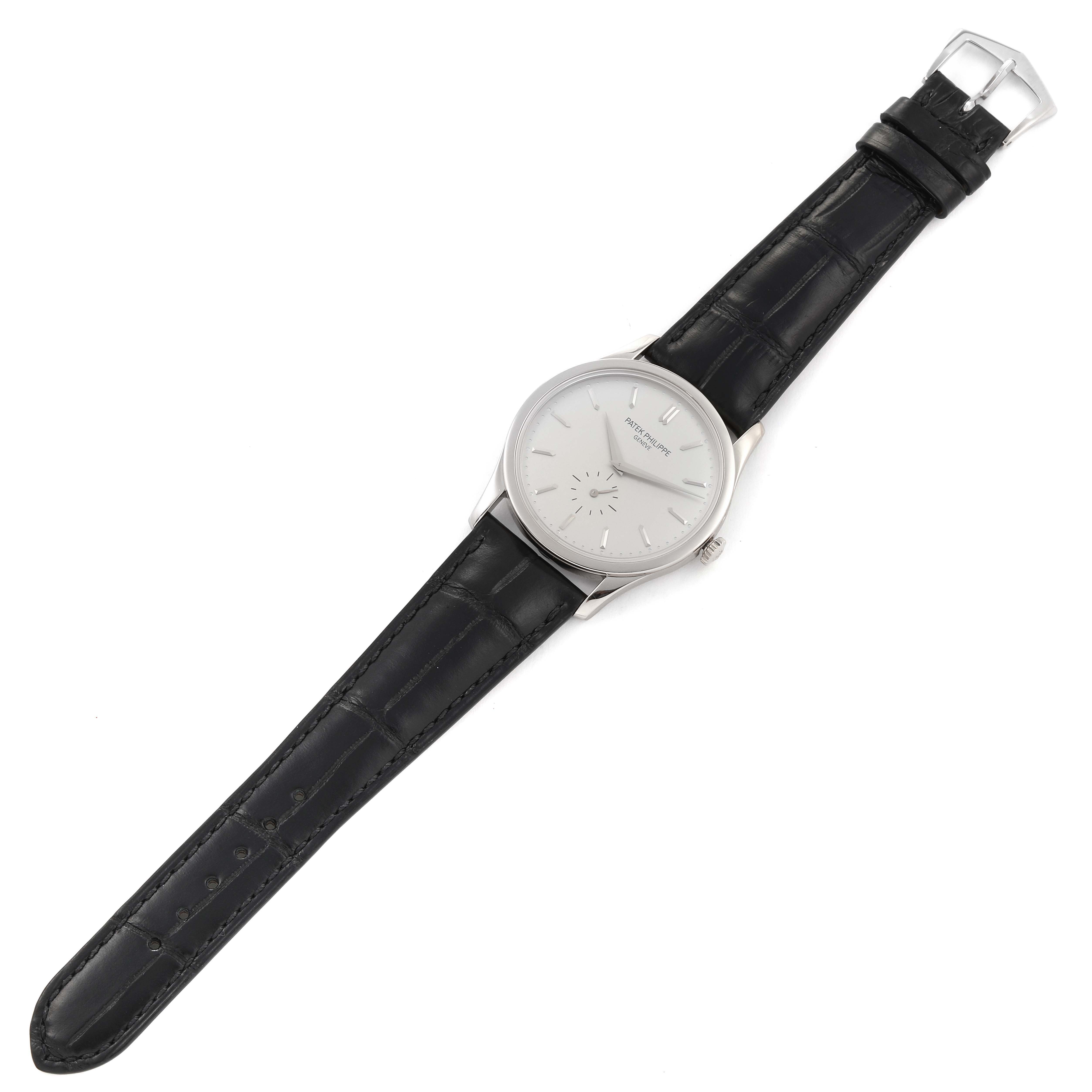 The image shows a Patek Philippe Calatrava 5196G Men's White Gold Silver Dial 5196G Men's White Gold Silver Dial watch from a top-down angle, displaying the face, black leather strap, and buckle.