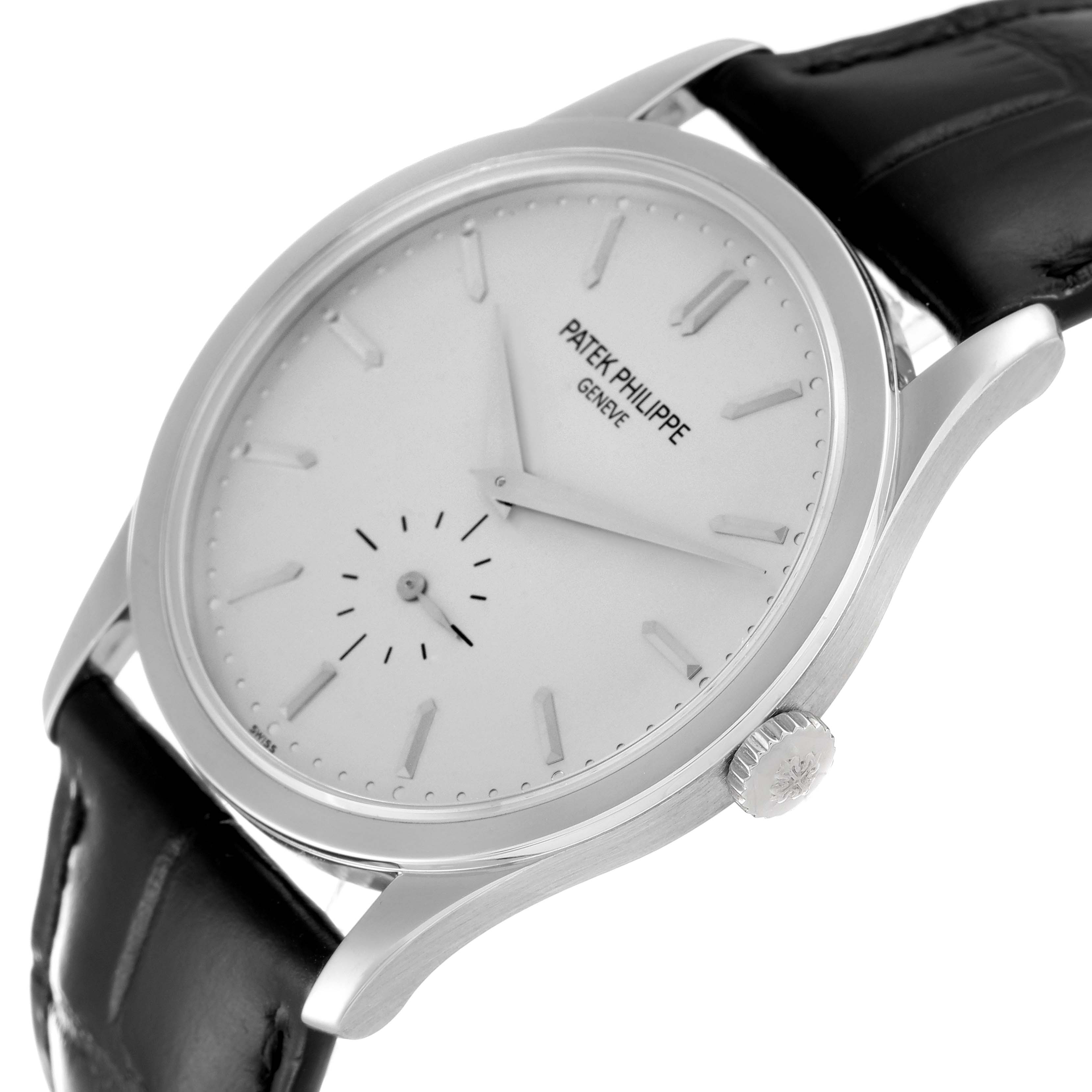 The image shows a Patek Philippe Calatrava 5196G Men's White Gold Silver Dial 5196G Men's White Gold Silver Dial watch at a slight angle, highlighting the dial, crown, and leather strap.