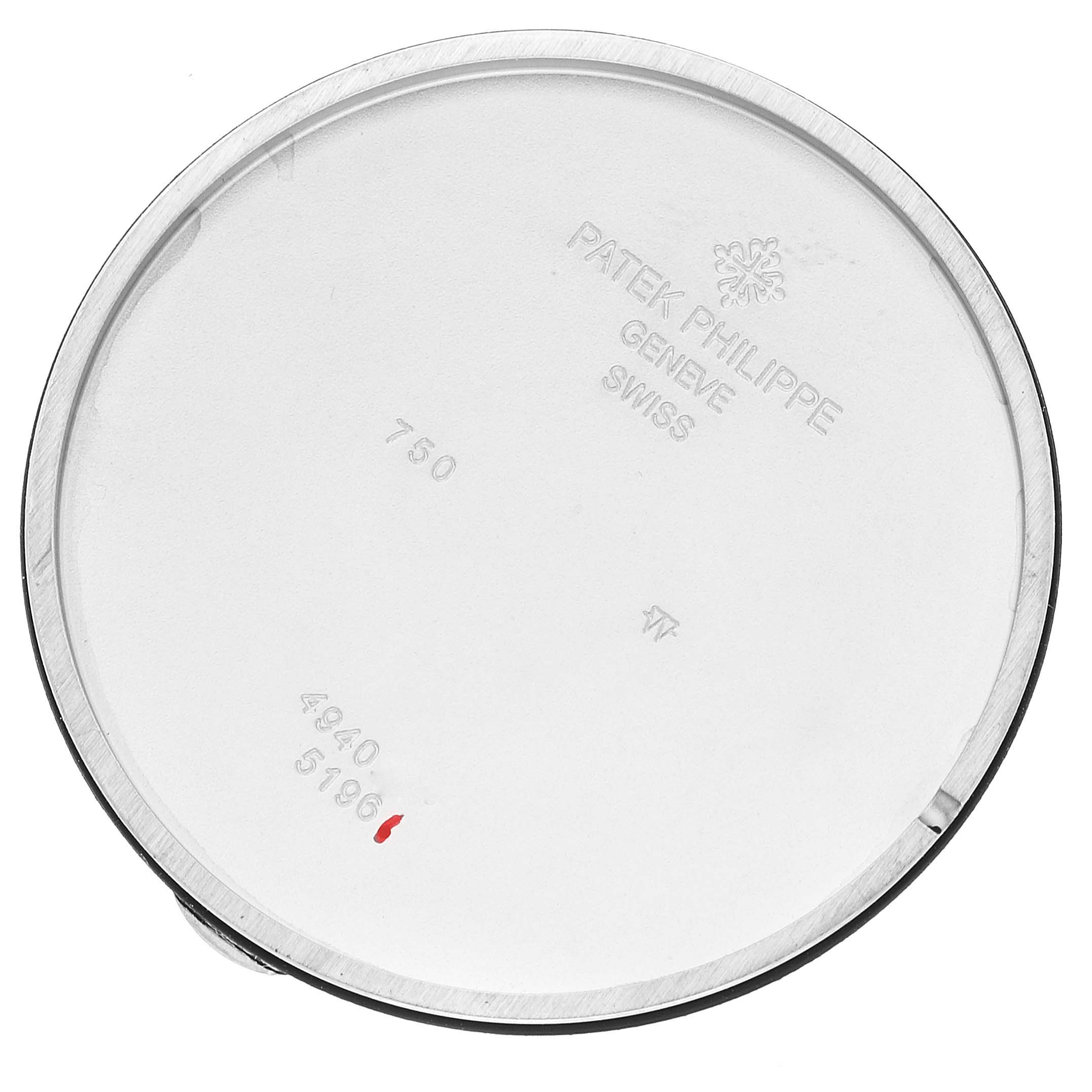 This is the inside of a Patek Philippe Calatrava 5196G Men's White Gold Silver Dial 5196G Men's White Gold Silver Dial watch case back, showing engraved markings and numbers.