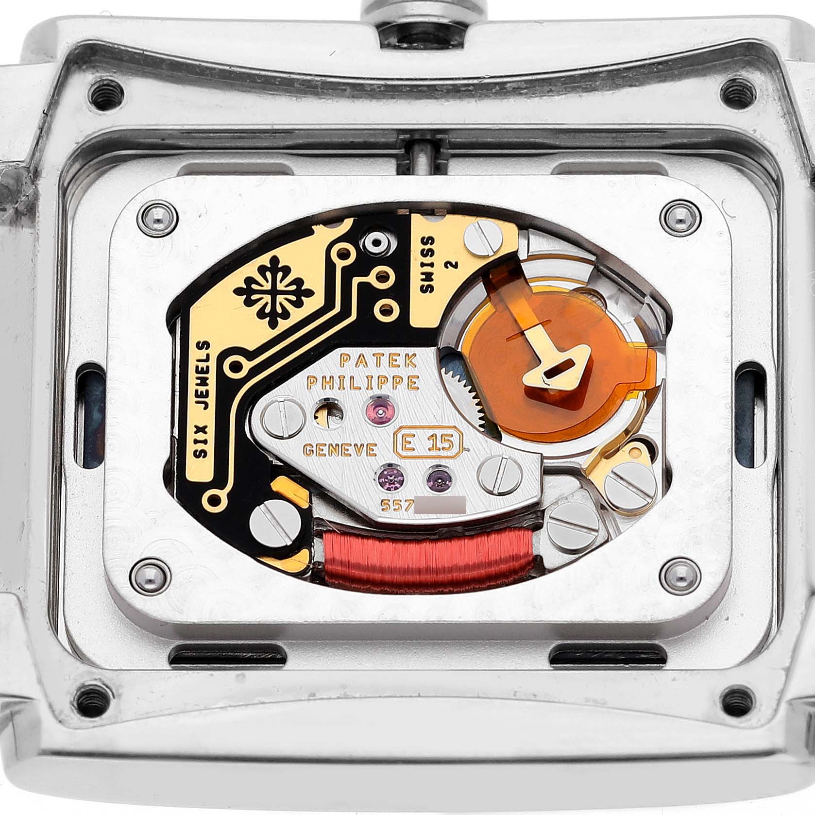 The image shows the back view of the Patek Philippe Twenty-4 4910/10A-012 Women's Stainless Steel Blue Dial 4910/10A-012 Women's Stainless Steel Blue Dial watch, highlighting its movement and intricate internal parts.