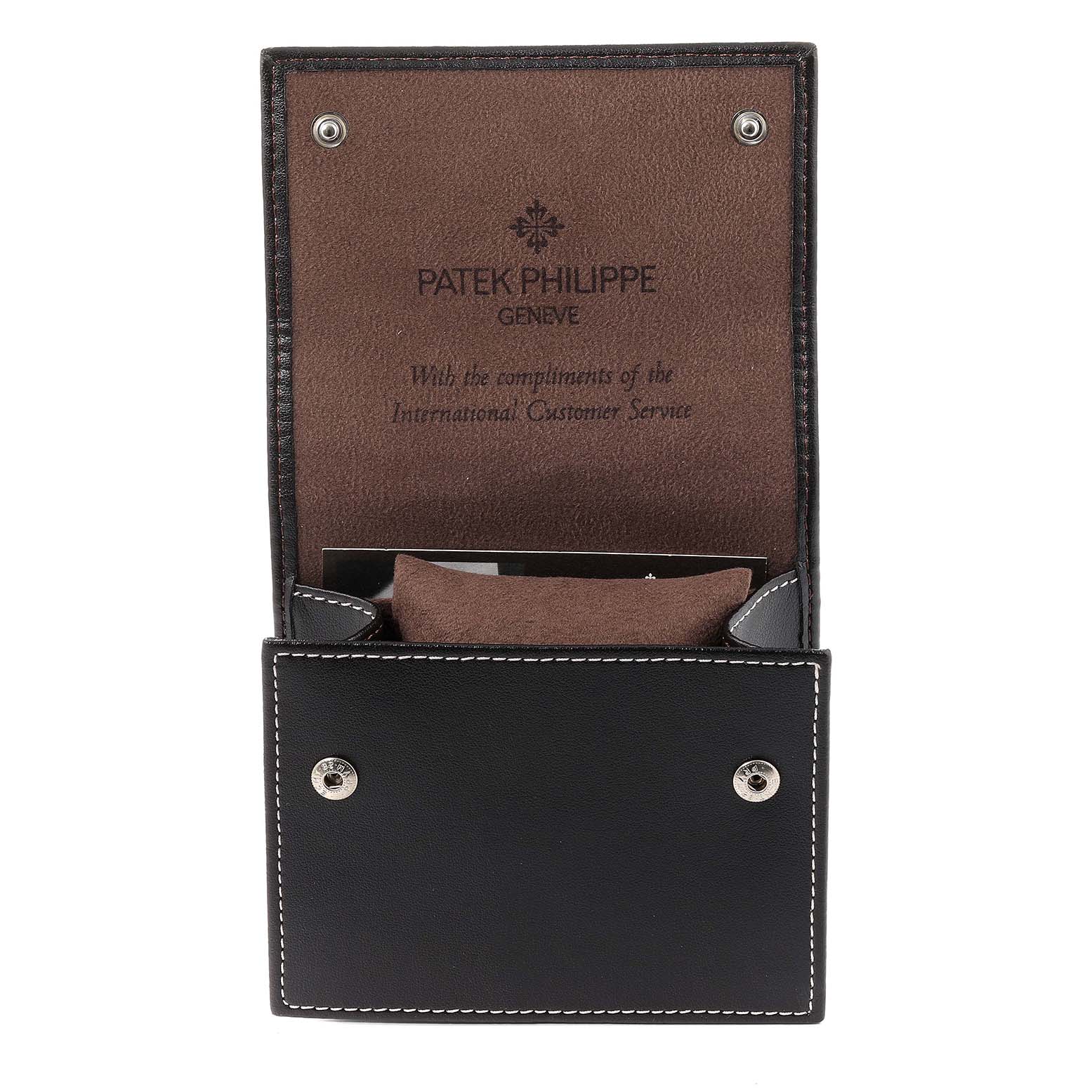 This image shows an open leather case for a Patek Philippe Twenty-4 4910/10A-012 Women's Stainless Steel Blue Dial 4910/10A-012 Women's Stainless Steel Blue Dial watch, featuring the brand's logo and complimentary message.