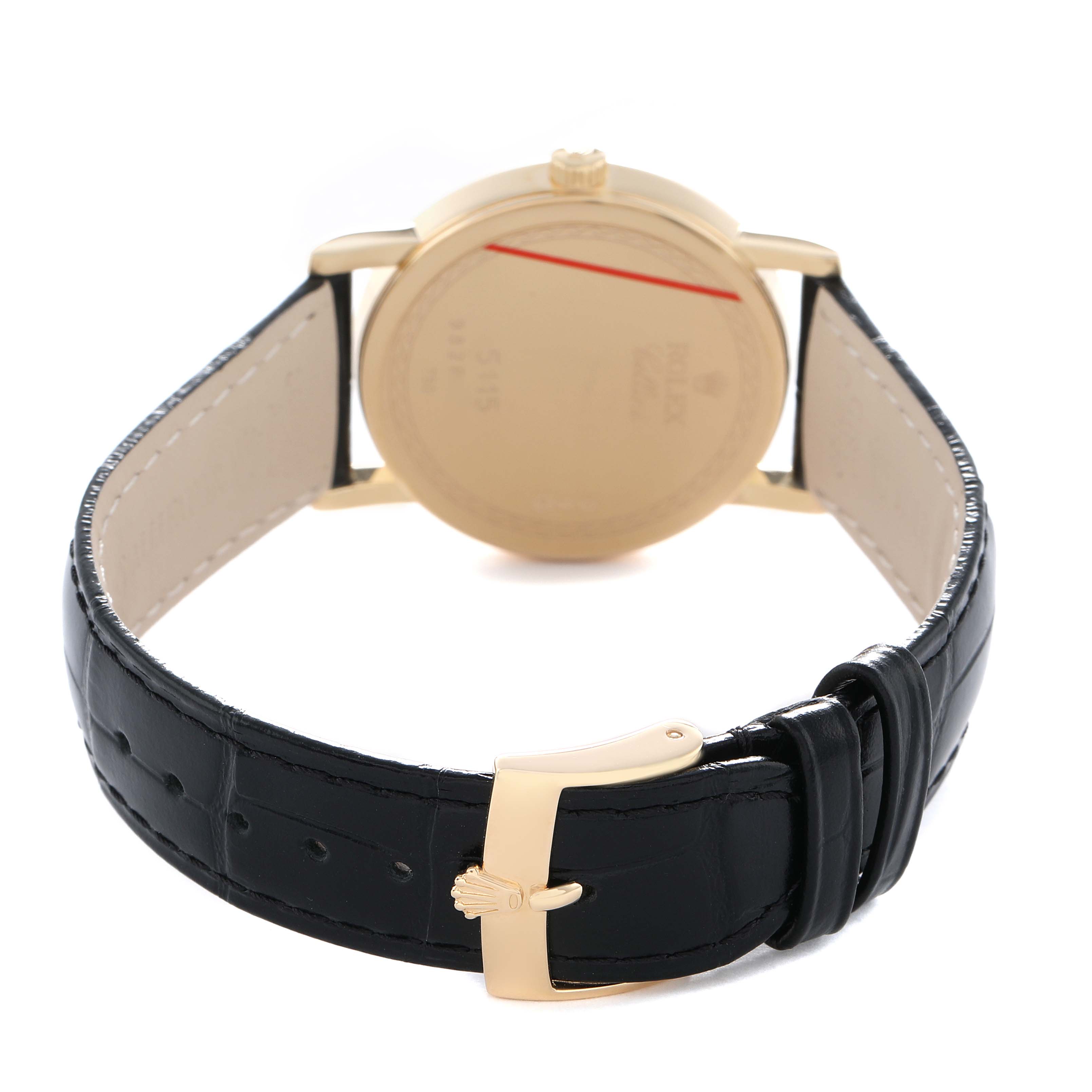 The Rolex Cellini 5115 Men's Yellow Gold Beige Dial watch is shown from the back, highlighting the clasp, leather strap, and the case back.