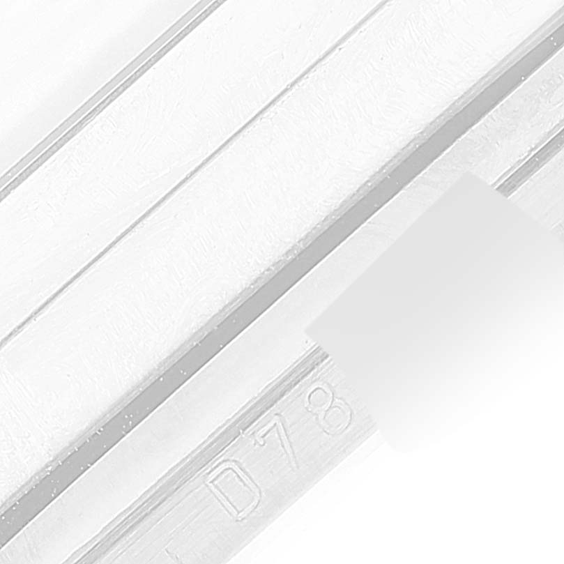 This image shows a close-up of the serial number engraved on a part of a Rolex Cellini 5443/9 Men's White Gold Black Dial 5443/9 Men's White Gold Black Dial watch.