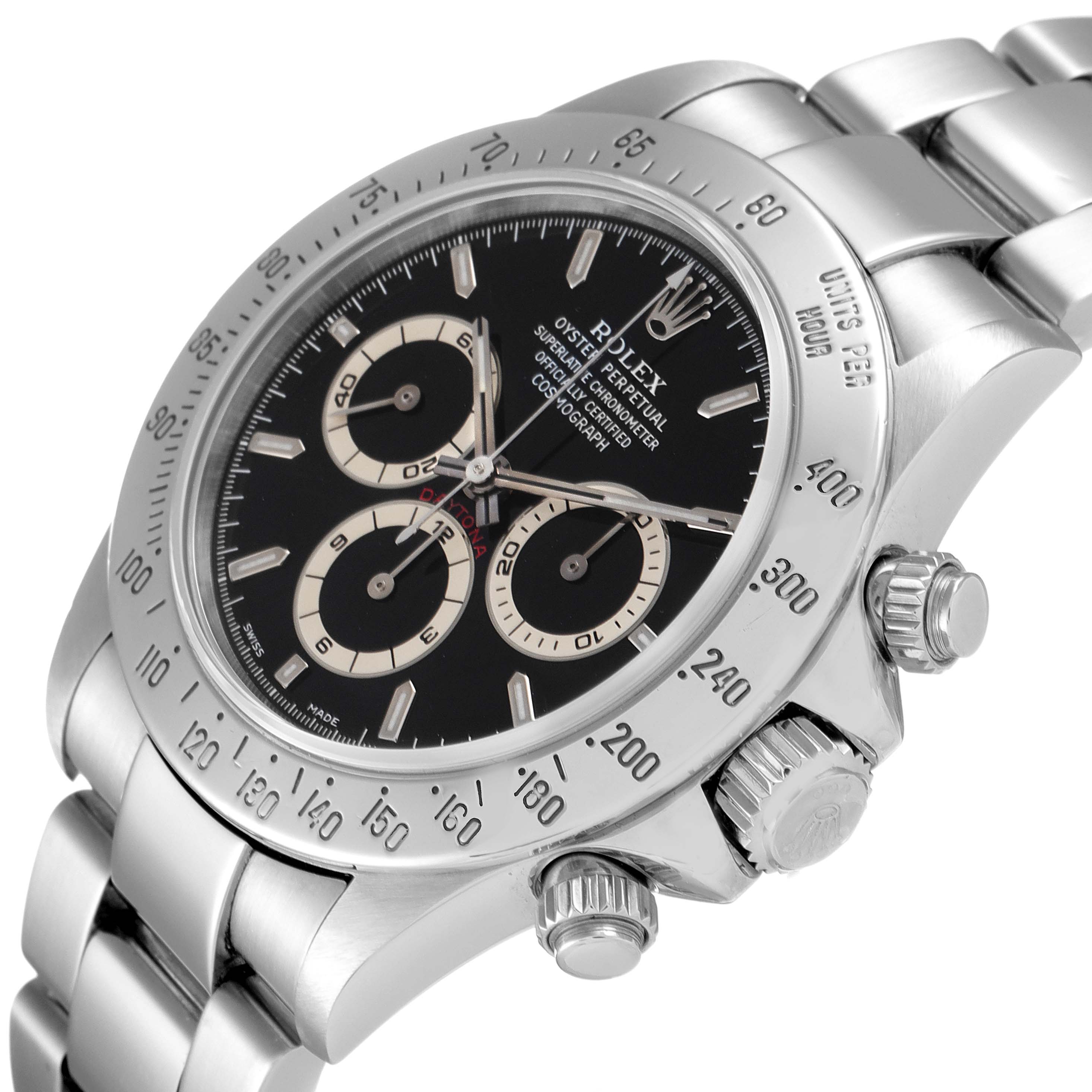 The image shows the Rolex Daytona 16520 Men's Stainless Steel Black Dial 16520 Men's Stainless Steel Black Dial watch from an oblique angle, highlighting the black dial, three subdials, and stainless steel bracelet.