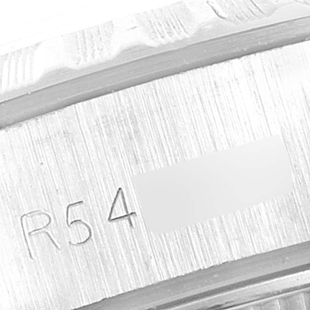 The image shows a close-up of the serial number engraving on the side of a Rolex Date 69240 Women's Stainless Steel Silver Dial 69240 Women's Stainless Steel Silver Dial model watch case.