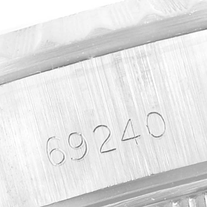 This close-up image shows the case side of a Rolex Date 69240 Women's Stainless Steel Silver Dial 69240 Women's Stainless Steel Silver Dial model watch, featuring the model number "69240" engraved.