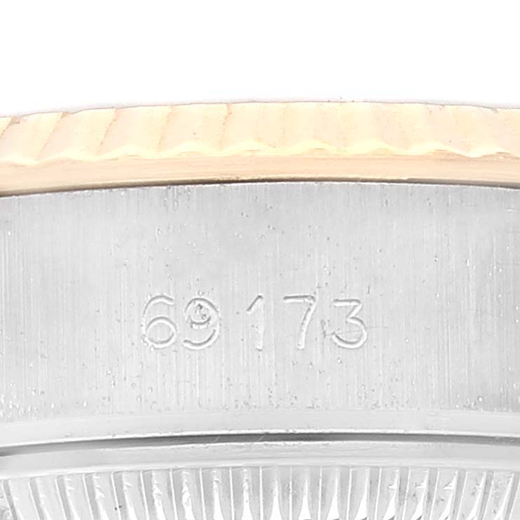 This image shows the side of a Rolex Datejust 69173 Women's Steel and Gold (two tone) Champagne Dial 69173 Women's Steel and Gold (two tone) Champagne Dial watch's case with the model number 69173 engraved.