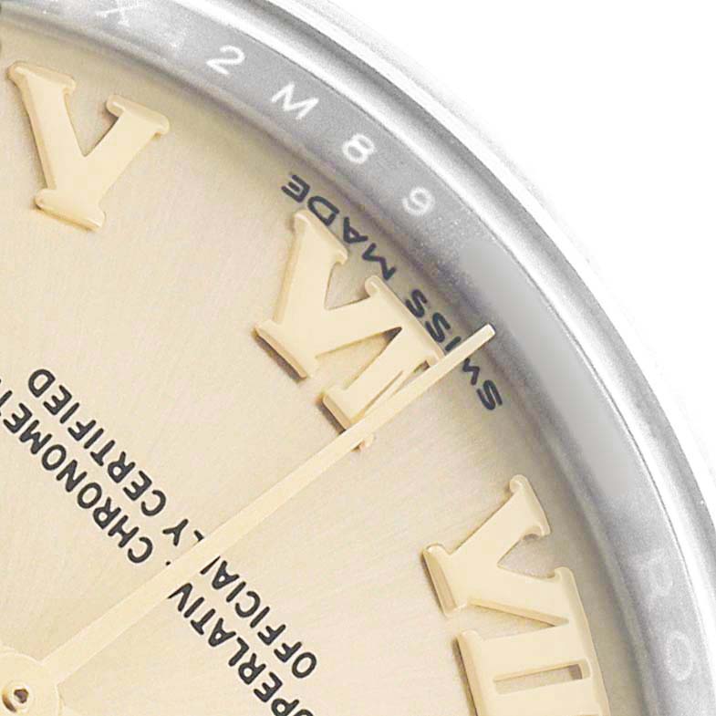 The image shows a close-up of the dial and bezel of a Rolex Datejust 279173 Women's Steel and Gold (two tone) Champagne Dial, featuring Roman numerals and part of the text.