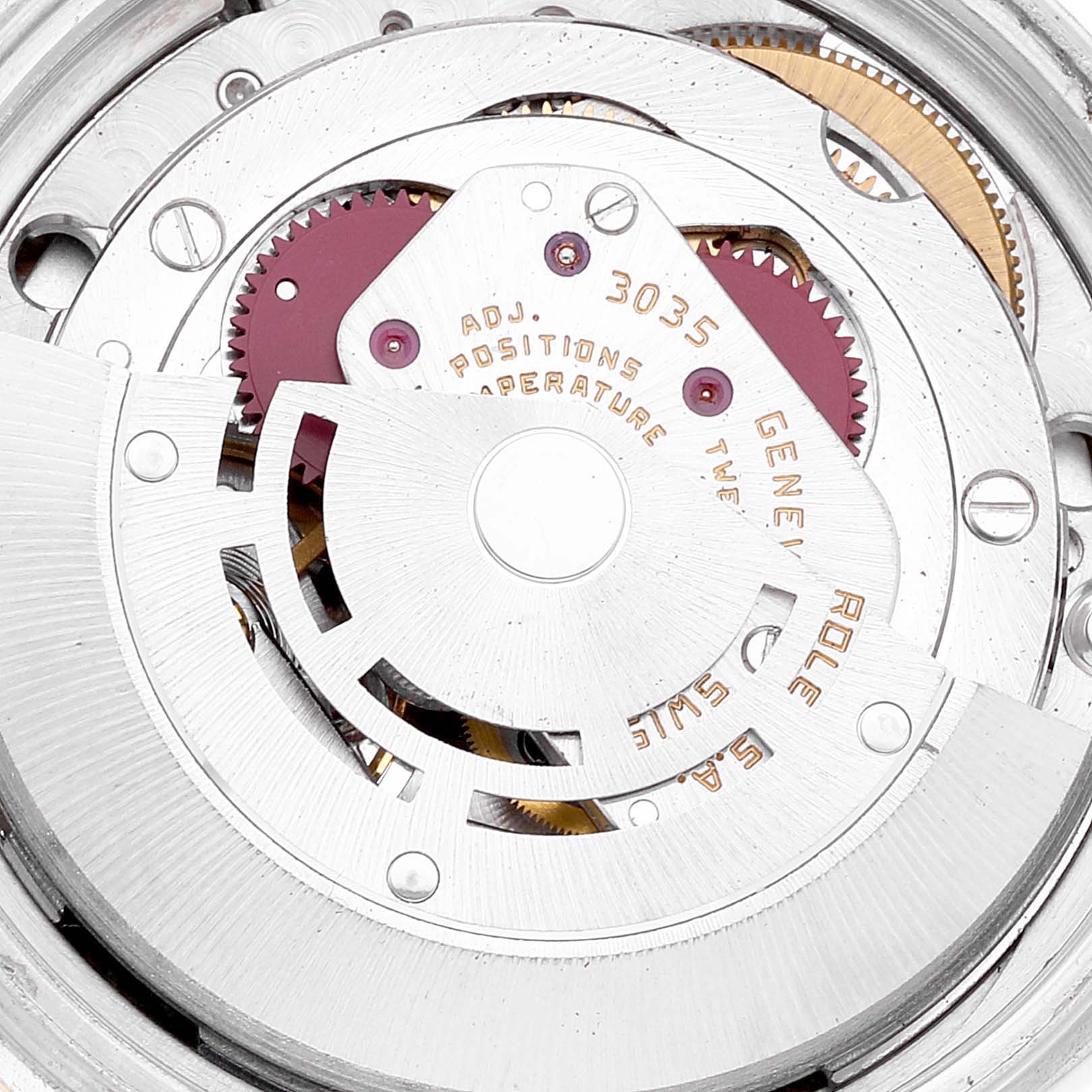 The image shows a close-up of the Rolex Datejust 16013 Men's Steel and Gold (two tone) Champagne Dial 16013 Men's Steel and Gold (two tone) Champagne Dial watch's internal movement components.