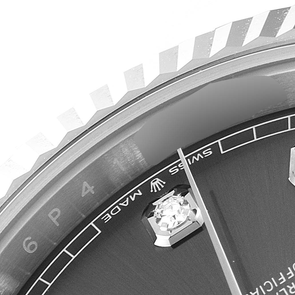 This close-up image of the Rolex Datejust 41 126334 Men's Stainless Steel Grey Dial 126334 Men's Stainless Steel Grey Dial model shows a portion of the dial, bezel, and part of the hour hand.