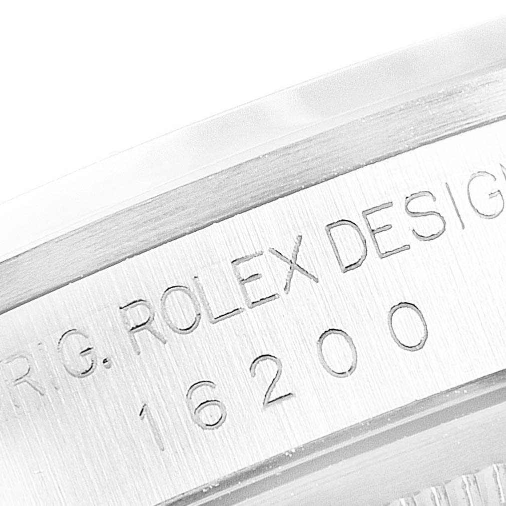 This image shows a close-up view of the engraved serial number on the case of a Rolex Datejust 16200 Men's Stainless Steel Black Dial 16200 Men's Stainless Steel Black Dial watch.
