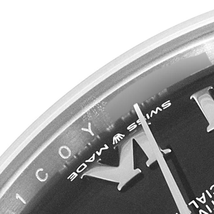 The image shows a close-up of the dial's top section including the hands and Roman numeral markers of a Rolex Mid-Size 278274 Women's Stainless Steel Black Dial 278274 Women's Stainless Steel Black Dial watch.