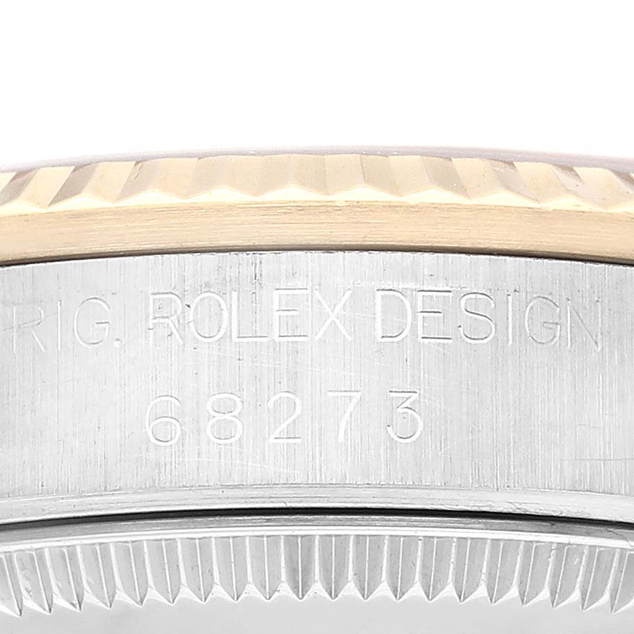 The image shows a close-up of the case side with the model number 68273 engraved on a Mid-Size Rolex watch.