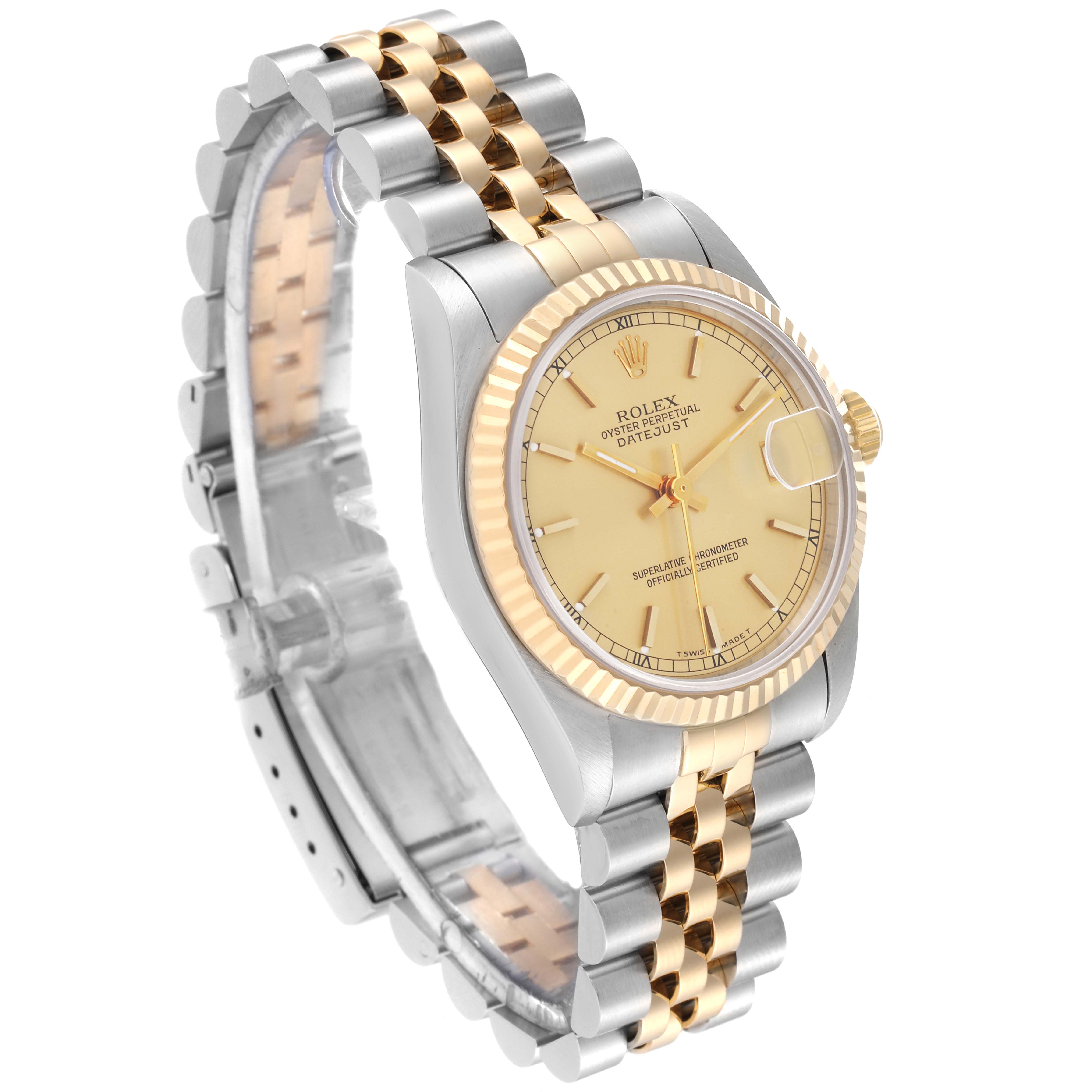 This image shows a three-quarter view of the Rolex Mid-Size 68273 Women's Steel and Gold (two tone) Champagne Dial 68273 Women's Steel and Gold (two tone) Champagne Dial Datejust watch, featuring its gold and silver bracelet and gold bezel and dial.