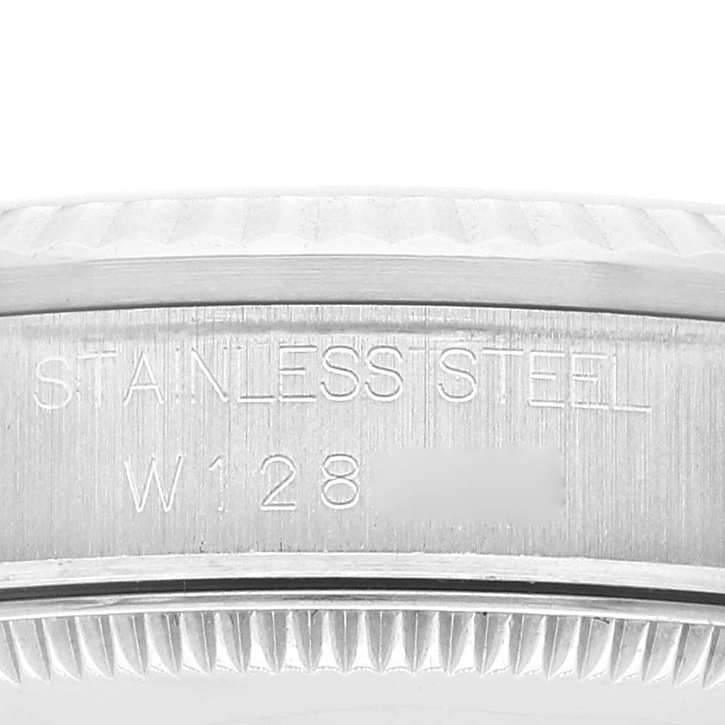 This image shows a close-up of the serial number engraving on the side of the stainless steel case of a Rolex Mid-Size 68274 Women
s Stainless Steel Black Dial 68274 Women
s Stainless Steel Black Dial model.
