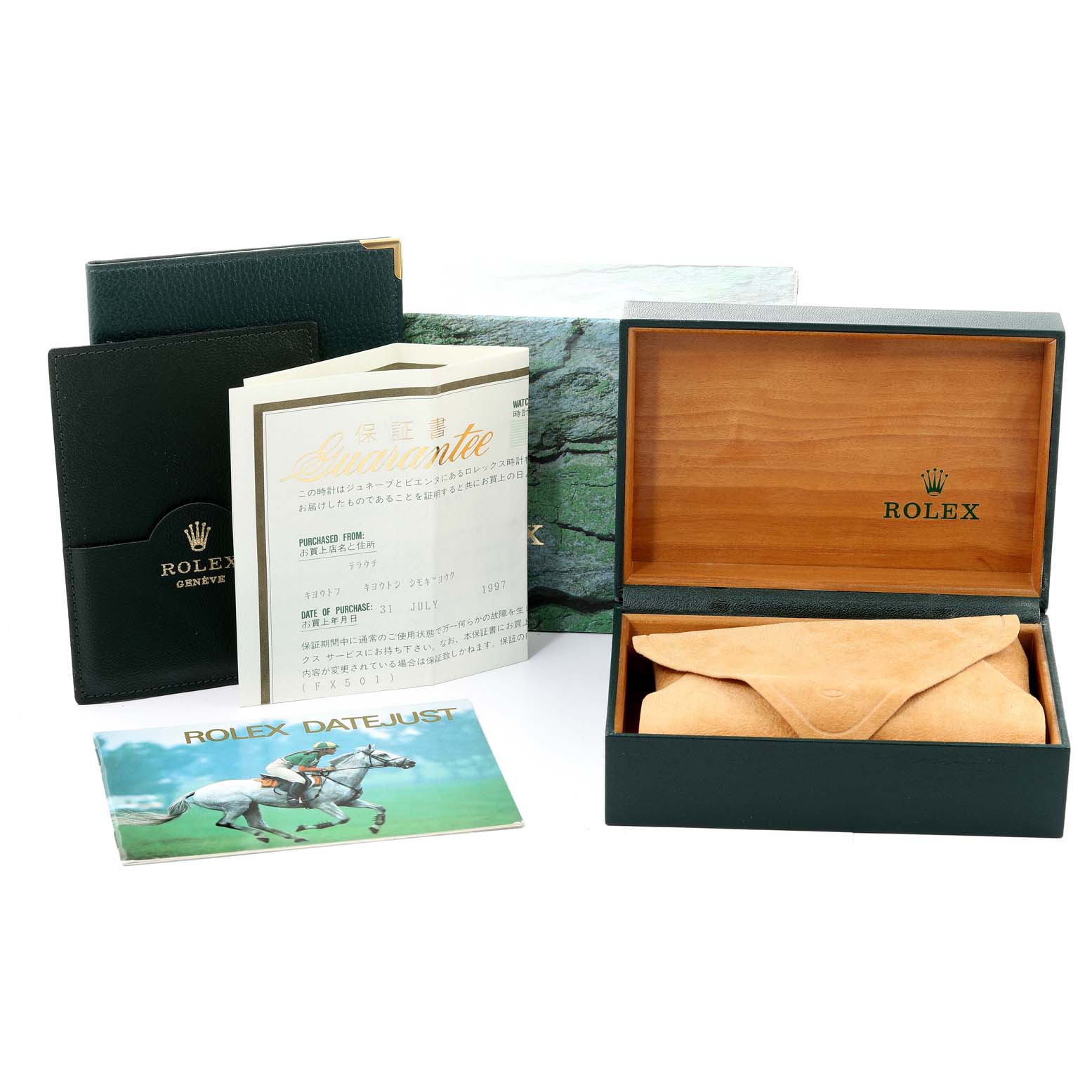 The image shows the accessories of a Rolex Mid-Size 68274 Women
s Stainless Steel Black Dial 68274 Women
s Stainless Steel Black Dial watch, including the box, guarantee card, and manuals.