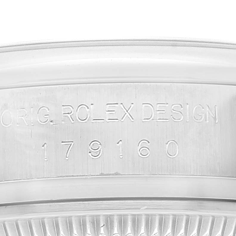 The image shows a close-up of the serial number "179160" and "ORIG. ROLEX DESIGN" engraving on a Rolex Datejust 179160 Women's Stainless Steel Pink Dial 179160 Women's Stainless Steel Pink Dial watch.