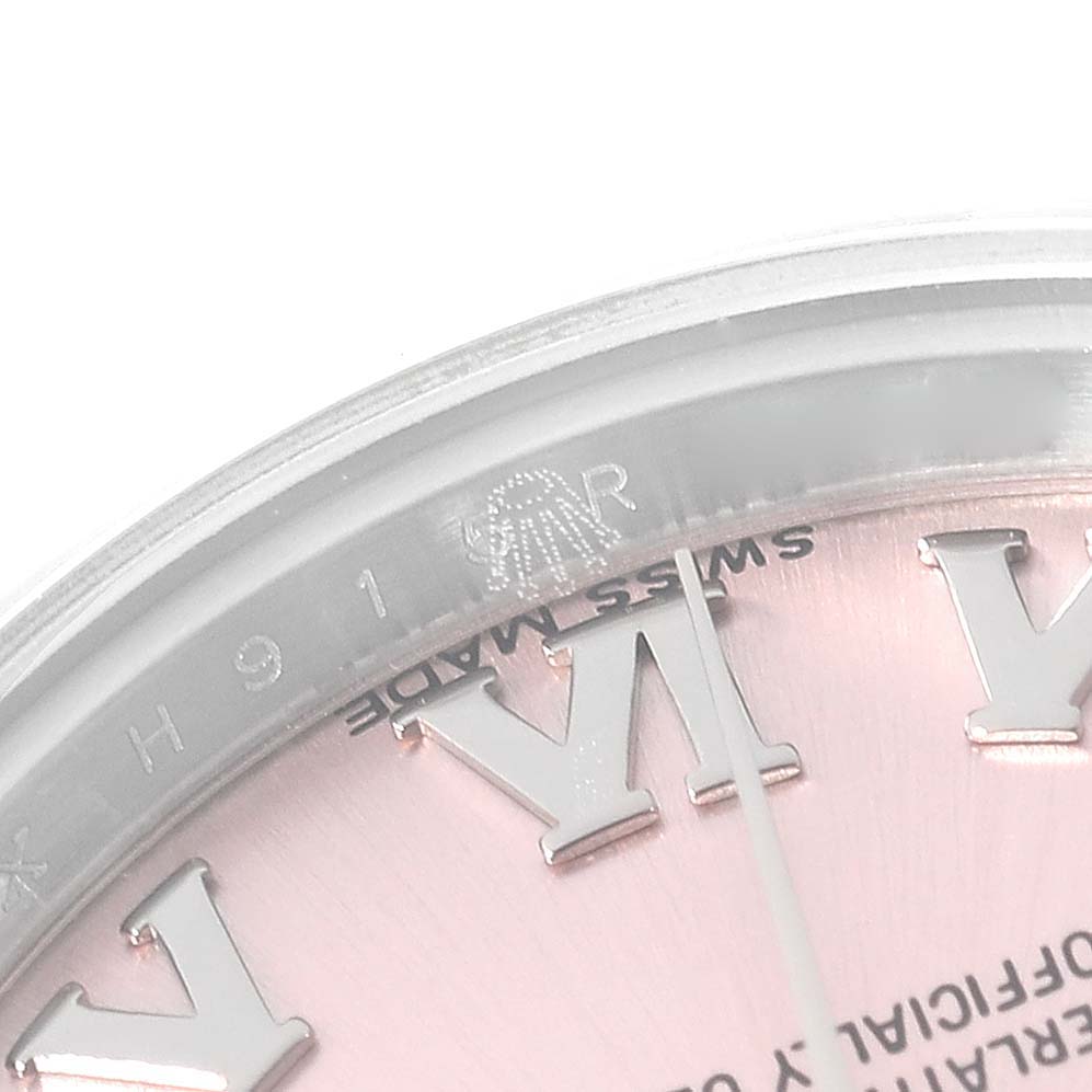This close-up angle shows the face and bezel details of a Rolex Datejust 179160 Women's Stainless Steel Pink Dial 179160 Women's Stainless Steel Pink Dial watch, including Roman numerals and part of the "Swiss Made" text.