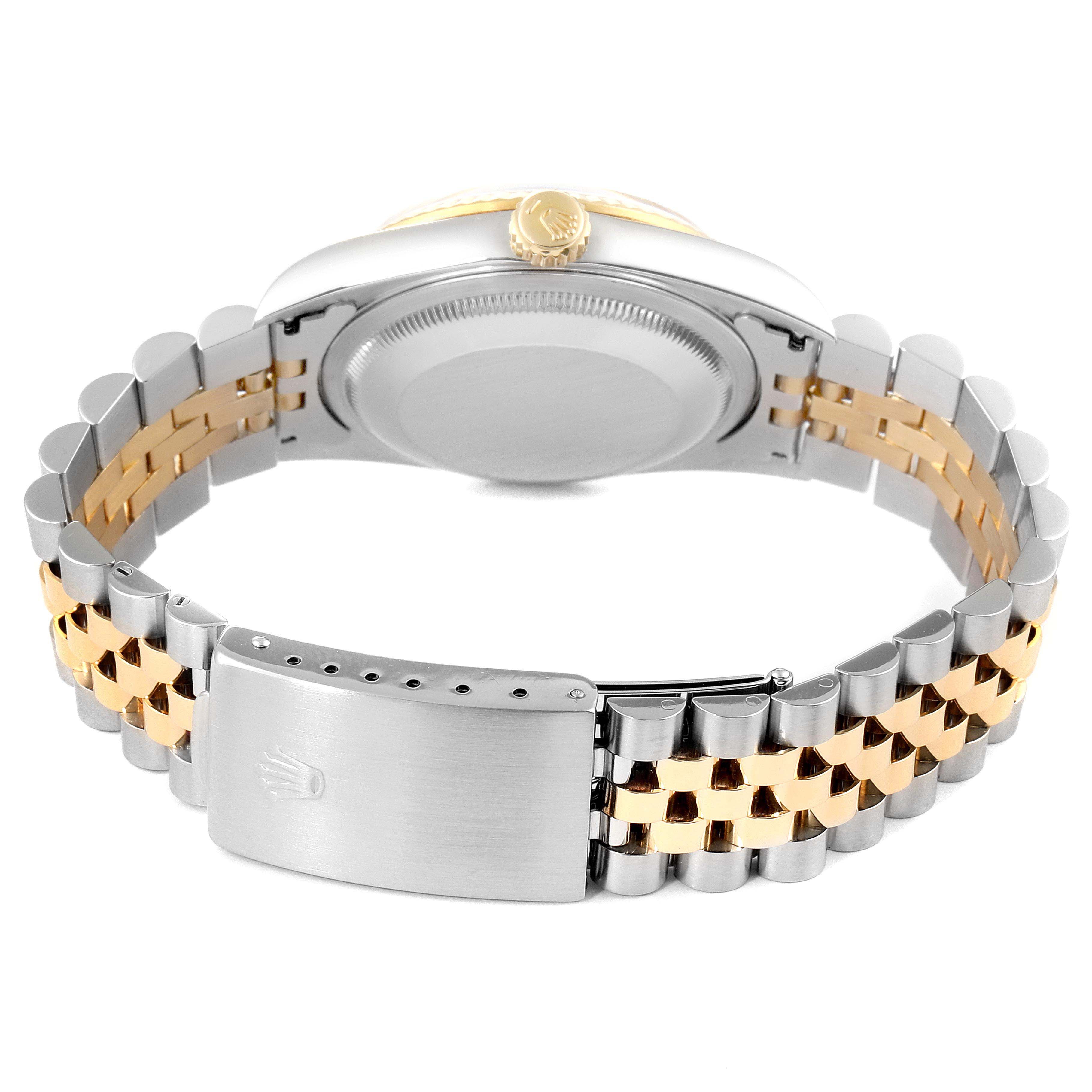 The image shows the back view of a Rolex Datejust 16233 Men's Steel and Gold (two tone) Champagne Dial 16233 Men's Steel and Gold (two tone) Champagne Dial watch, highlighting its two-tone metal bracelet and clasp.