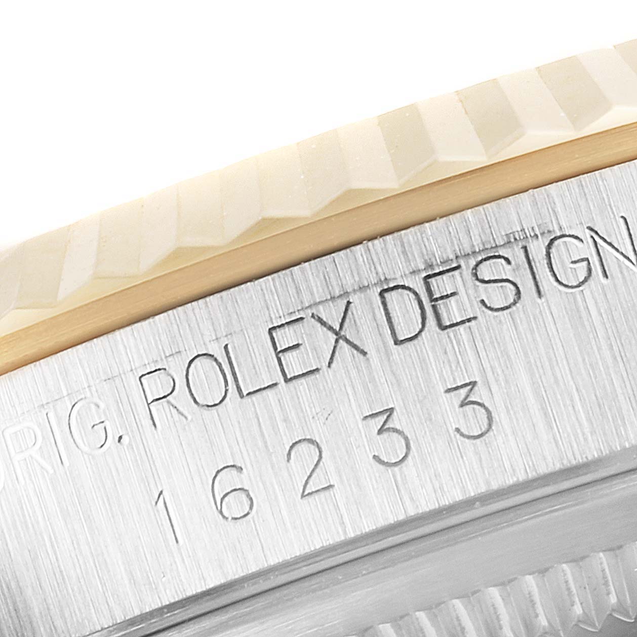 Close-up angle of the casing edge and model number of the Rolex Datejust 16233 Men's Steel and Gold (two tone) Champagne Dial 16233 Men's Steel and Gold (two tone) Champagne Dial watch.