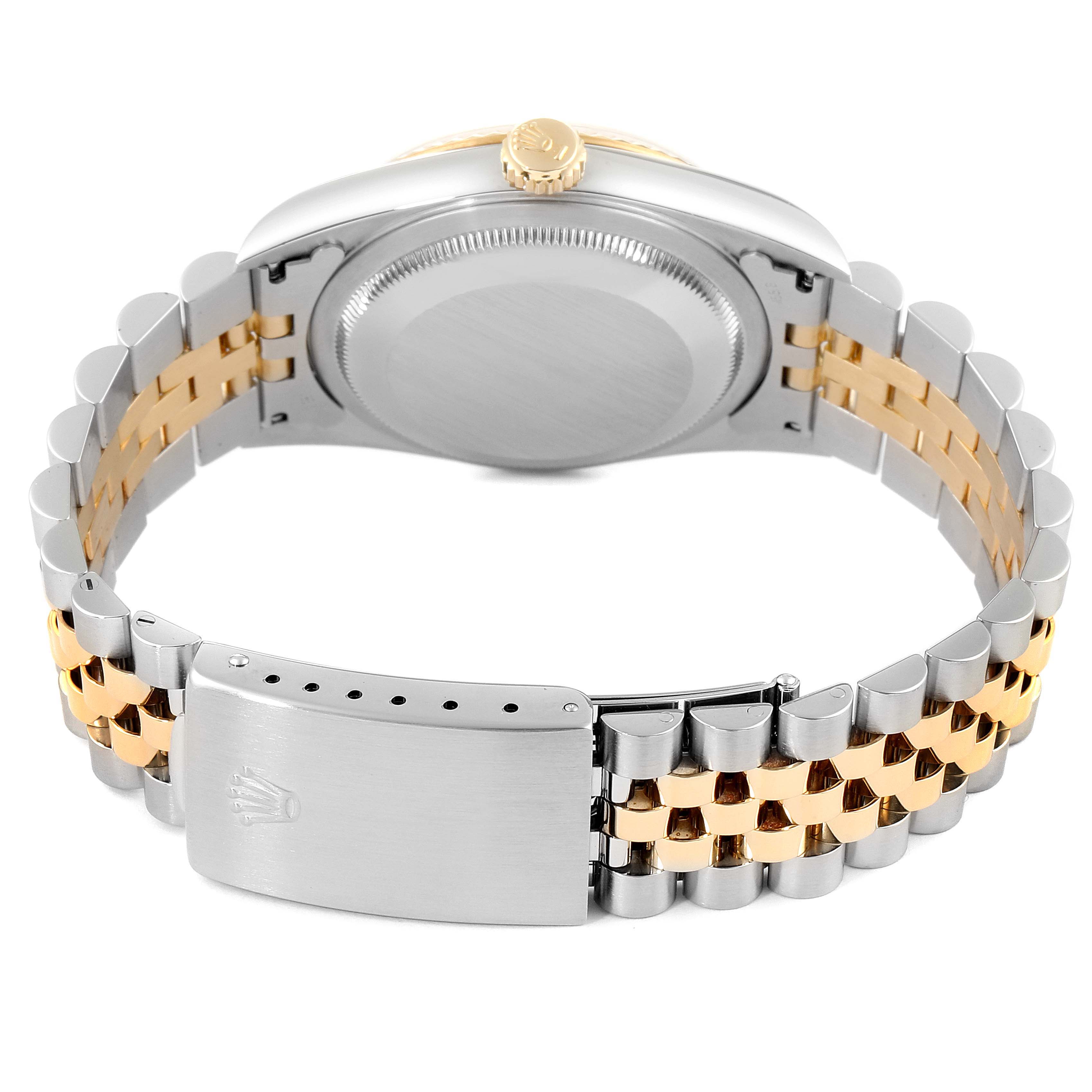 This image shows the back case, crown, and two-tone bracelet with clasp of a Rolex Datejust 16233 Men's Steel and Gold (two tone) Champagne Dial 16233 Men's Steel and Gold (two tone) Champagne Dial watch.